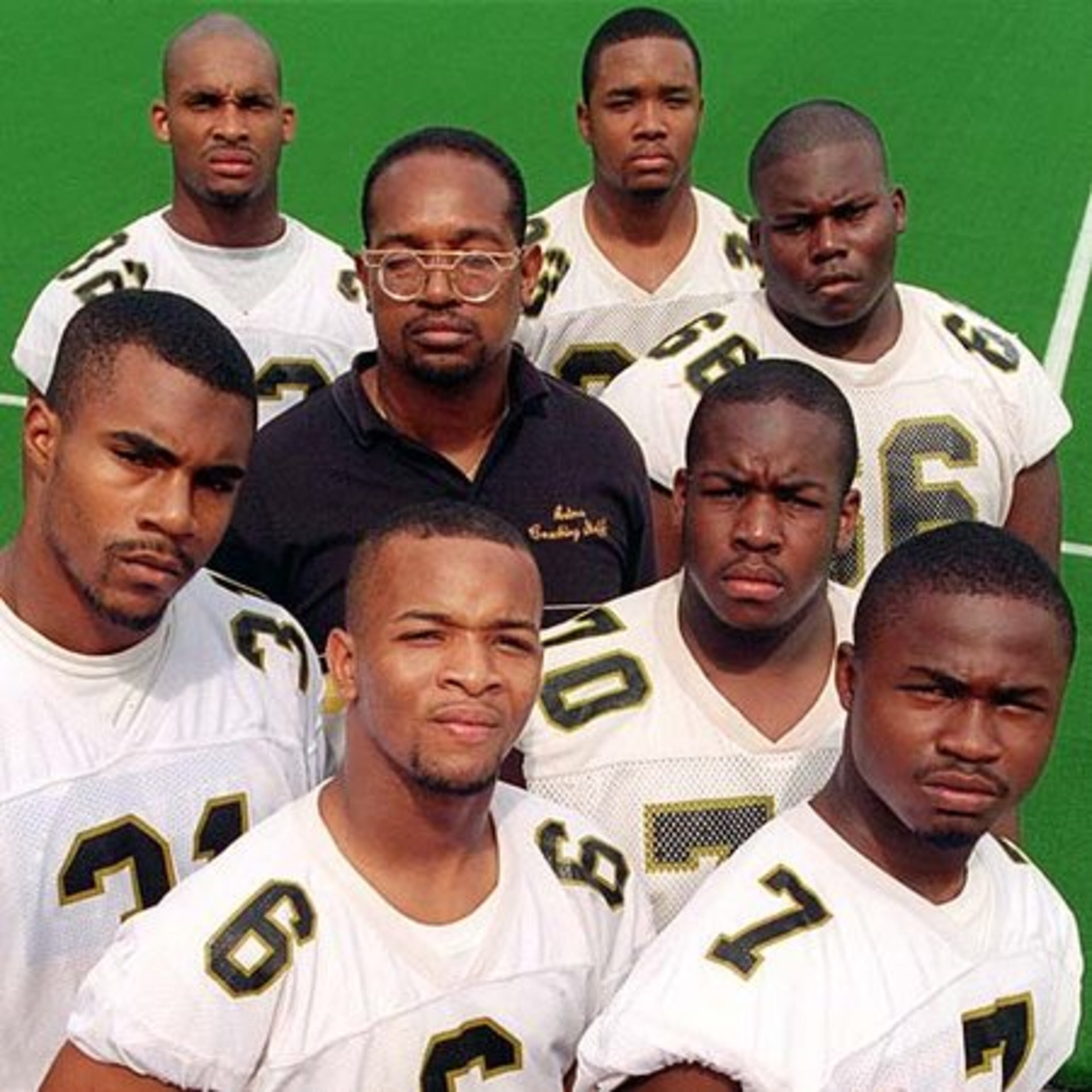 Lewis (31, left, in 1996) rushed for 1,716 yards and 25 TD as a senior and earned AAAA All-State and All-City honors.