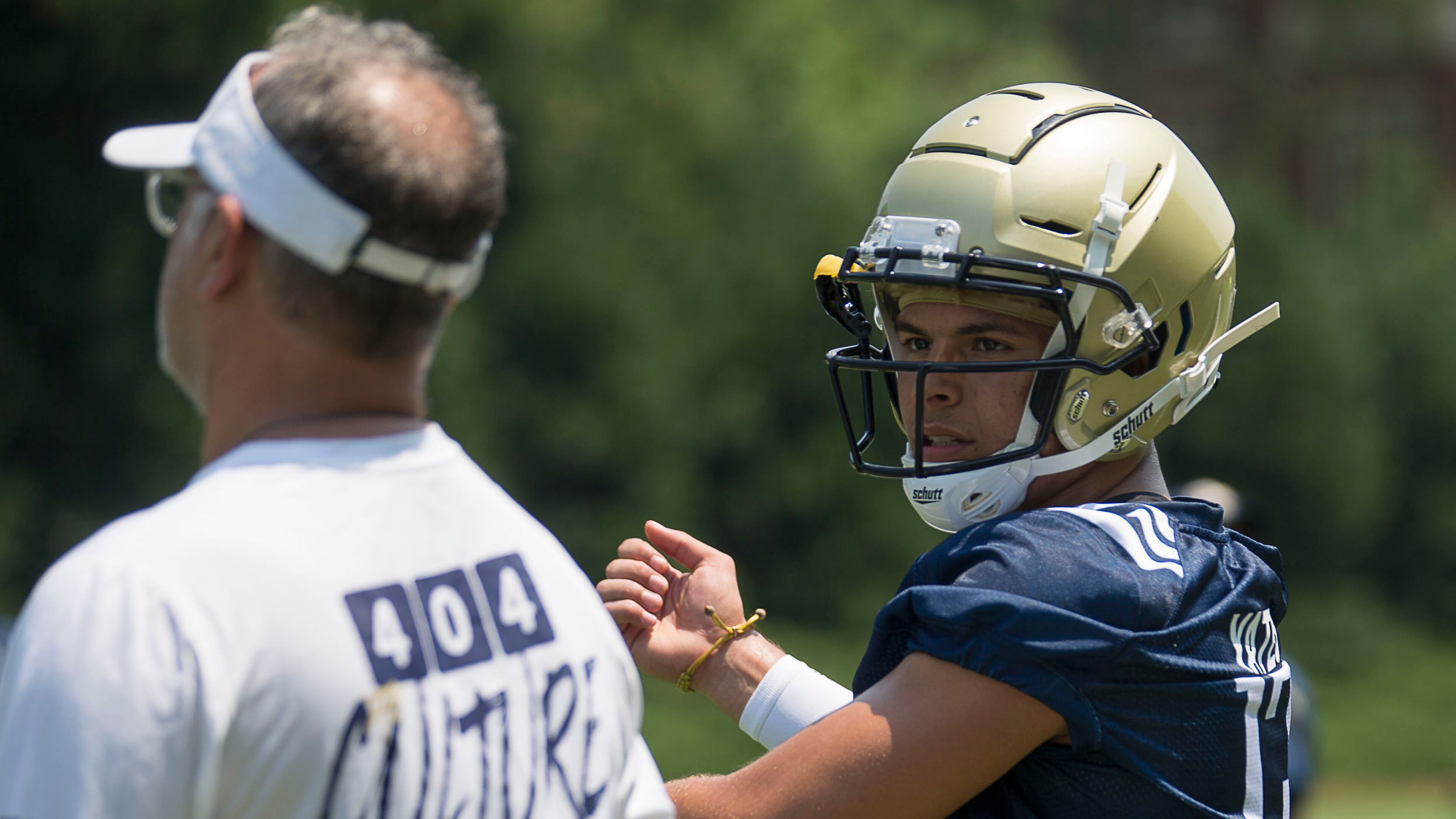 Georgia Tech quarterback Jordan Yates (13) looks for assistance as he calls a play. (Alyssa Pointer/alyssa.pointer@ajc.com)