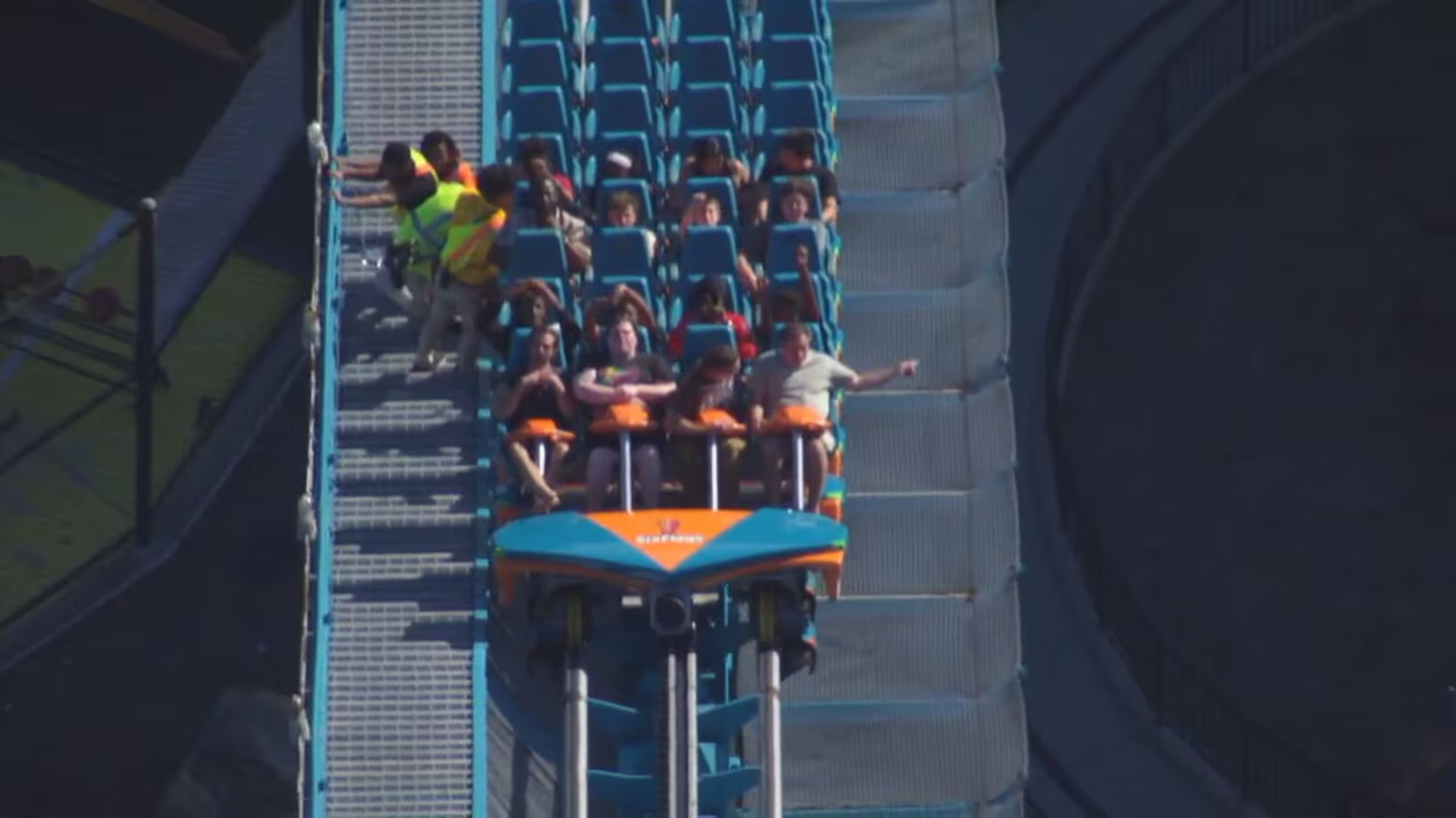 Riders on the Goliath roller coaster at Six Flags Over Georgia in Austell are evacuated by park personnel on Monday, Oct. 12, 2026. One person died and several others were injured in “an incident involving a roller coaster” at Six Flags Over Georgia, Cobb County Police said Monday evening. (Courtesy WSB-TV)