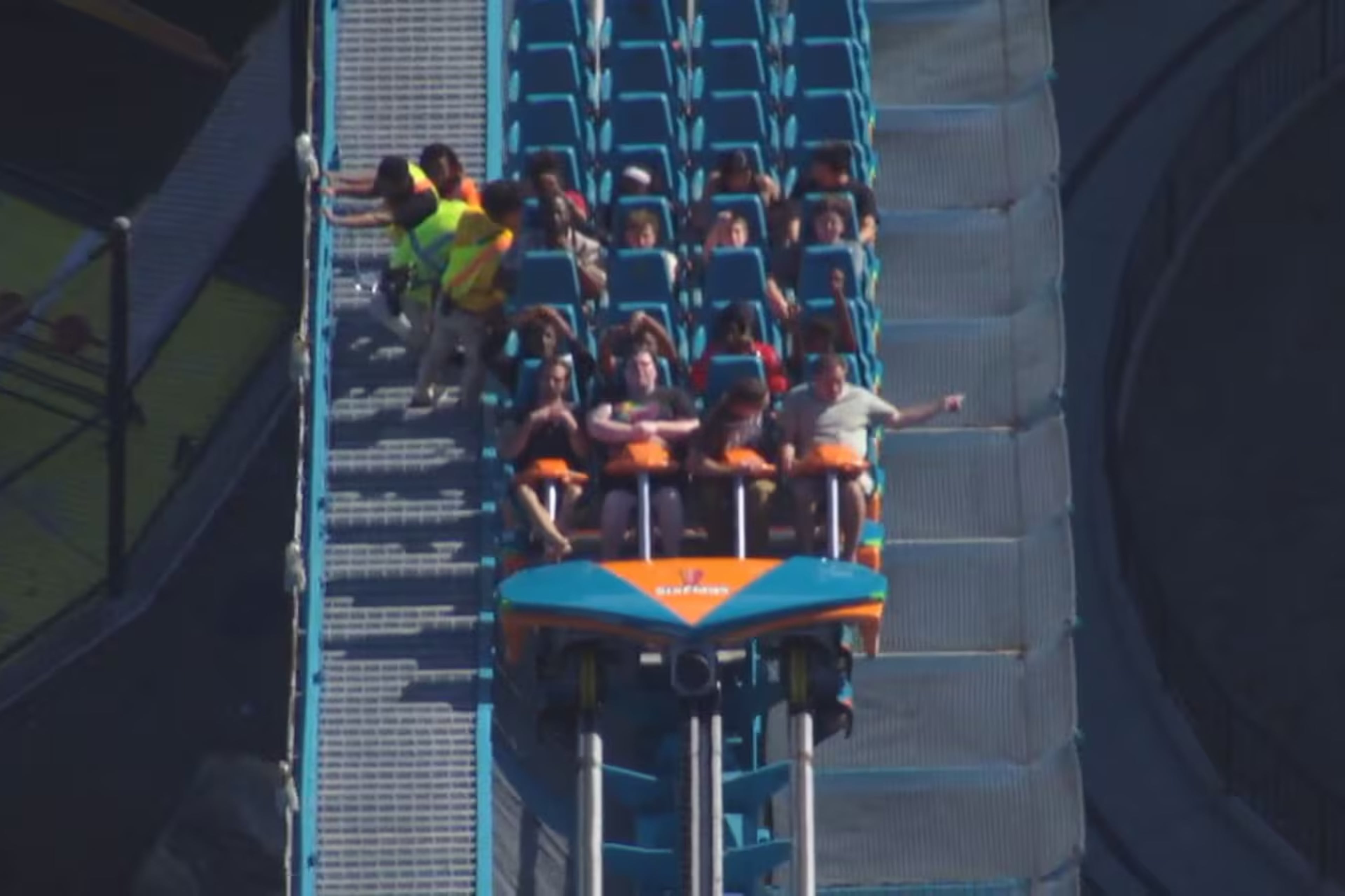 The Goliath roller coaster at Six Flags over Georgia in Austell is evacuated by park personnel on Monday, Oct. 12, 2026. One person died and several others were injured in “an incident involving a roller coaster” at the park, Cobb County Police said Monday evening. (Courtesy WSB-TV)