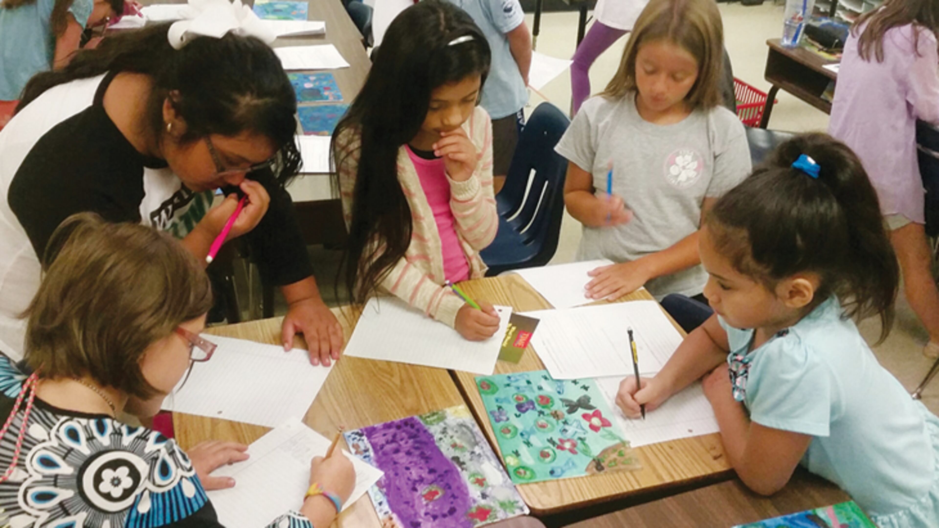 Oak Grove Elementary School Fine Arts Academy fourth-graders (from left) Alexia Scott, Celia Ruiz, Sanieya Castillo, Brooklyn Webb and Marina Sapugay work on a school project. CHEROKEE COUNTY SCHOOLS