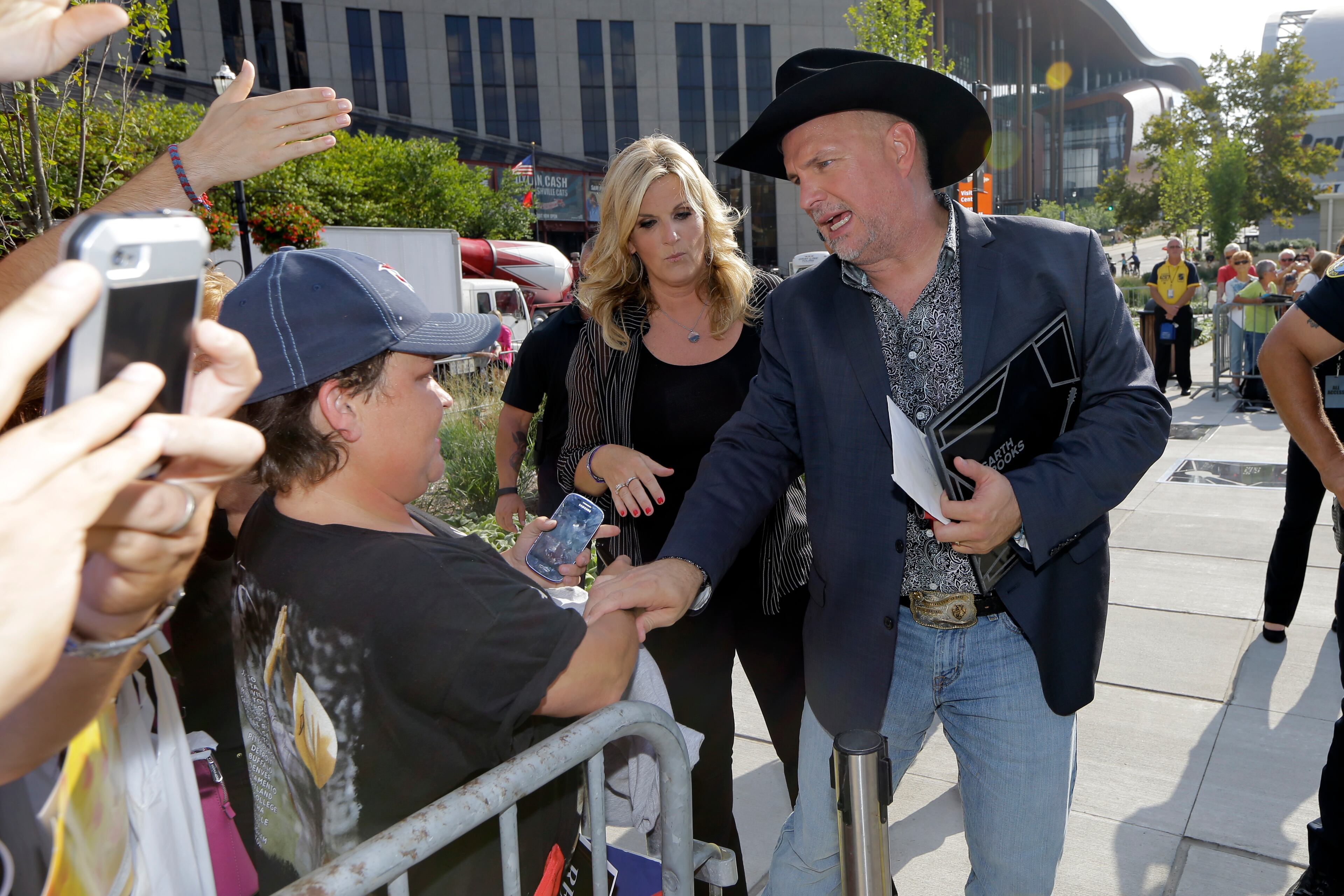 Garth Brooks and Trisha Yearwood greet fans after they both received a star on the Music City Walk of Fame on Thursday, Sept. 10, 2015, in Nashville, Tenn. (AP Photo/Mark Humphrey)