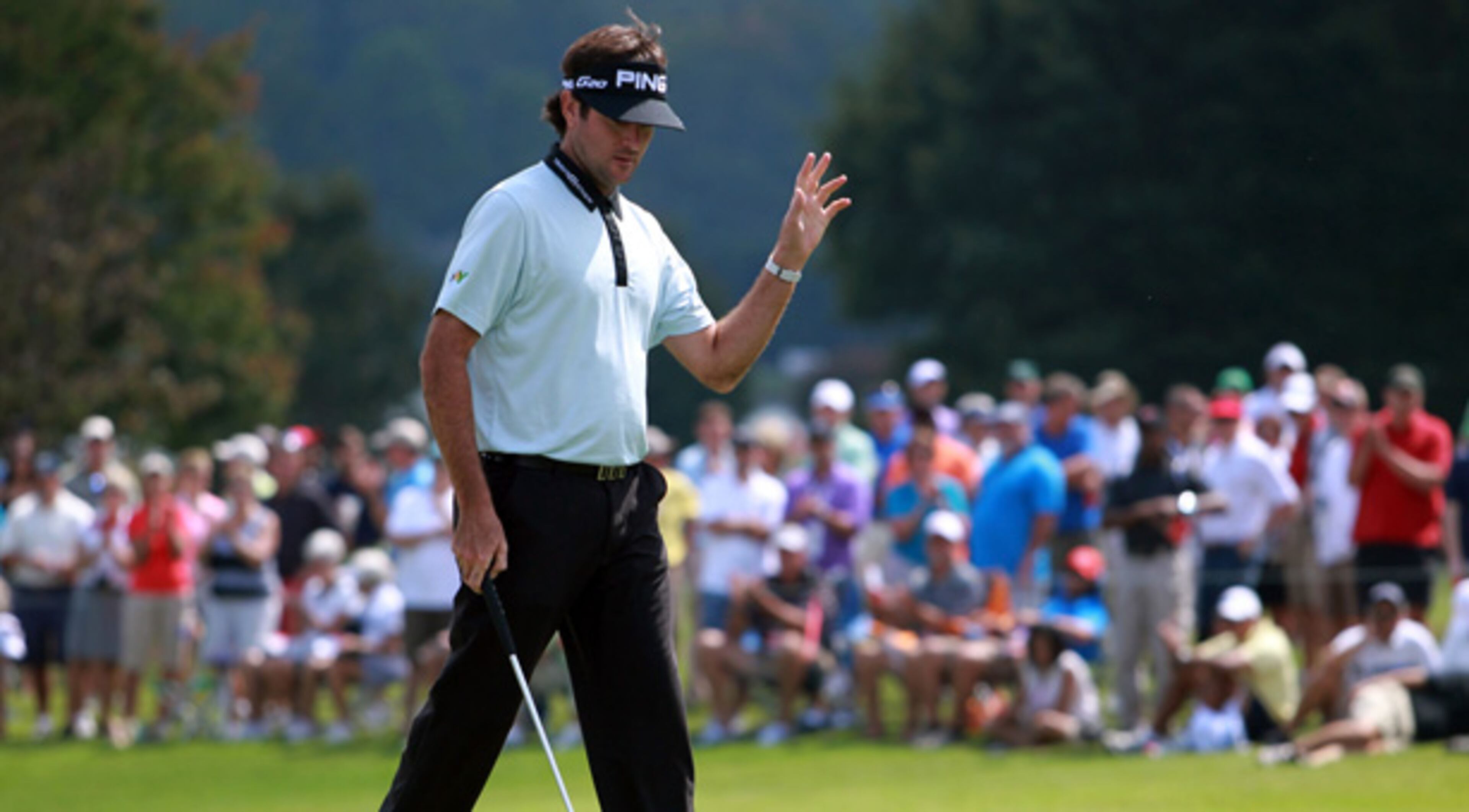 Masters winner Bubba Watson acknowledges fans after his putt on the No. 1 green during Round 2 of the Tour Championship at East Lake Golf Club Friday afternoon in Atlanta. Watson birdie the hole.