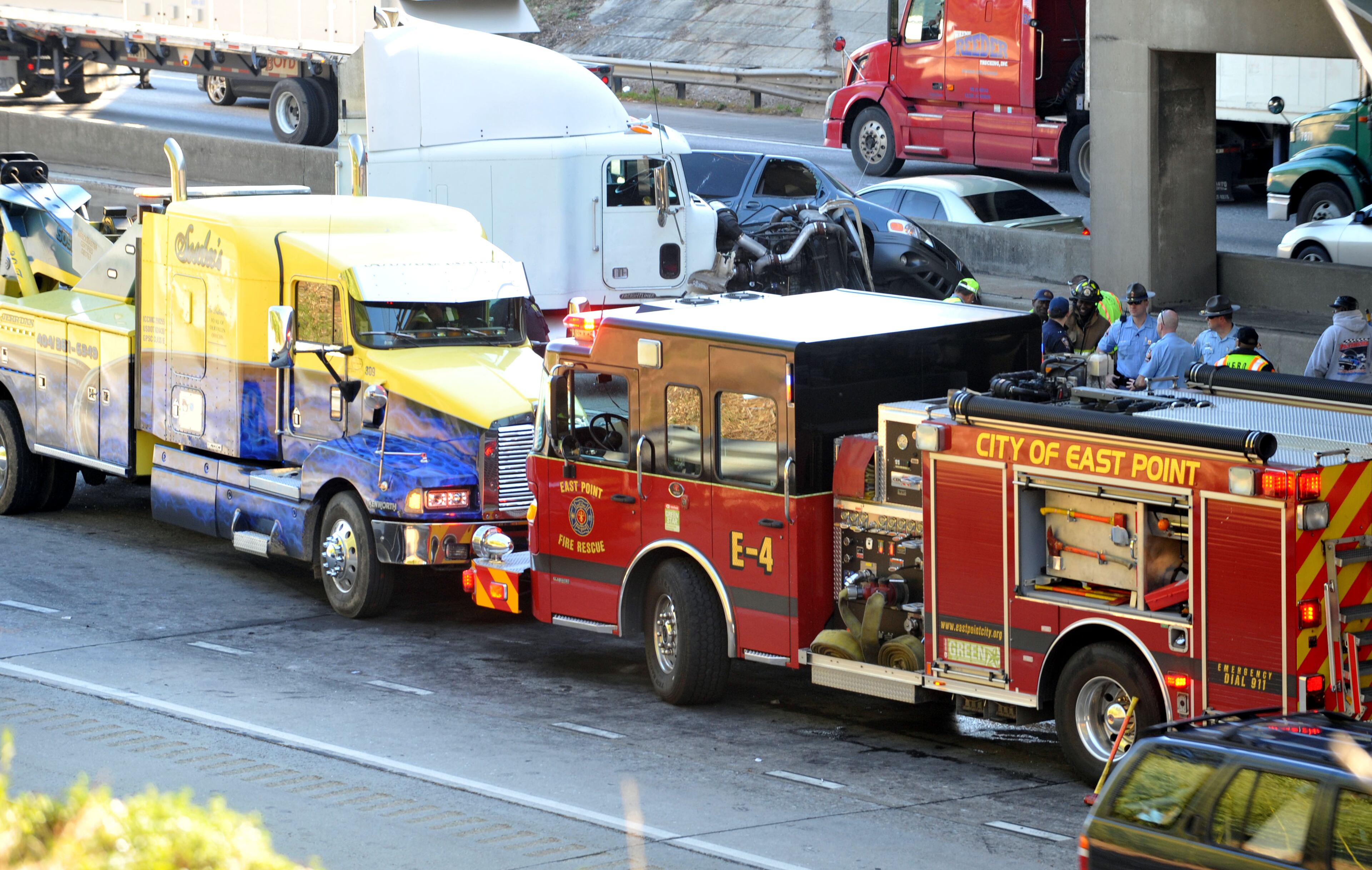 One person was killed and 2 others injured in a wreck on Interstate 285 at Washington Road in East Point Tuesday March 12, 2013. The wreck was cause by a ladder in the road which forced one motorist to stop, which was then rear-ended by a tractor-trailer rig. A total of four vehicles were involved in the wreck according to Lt Cliff Chandler, East Point Police PIO.