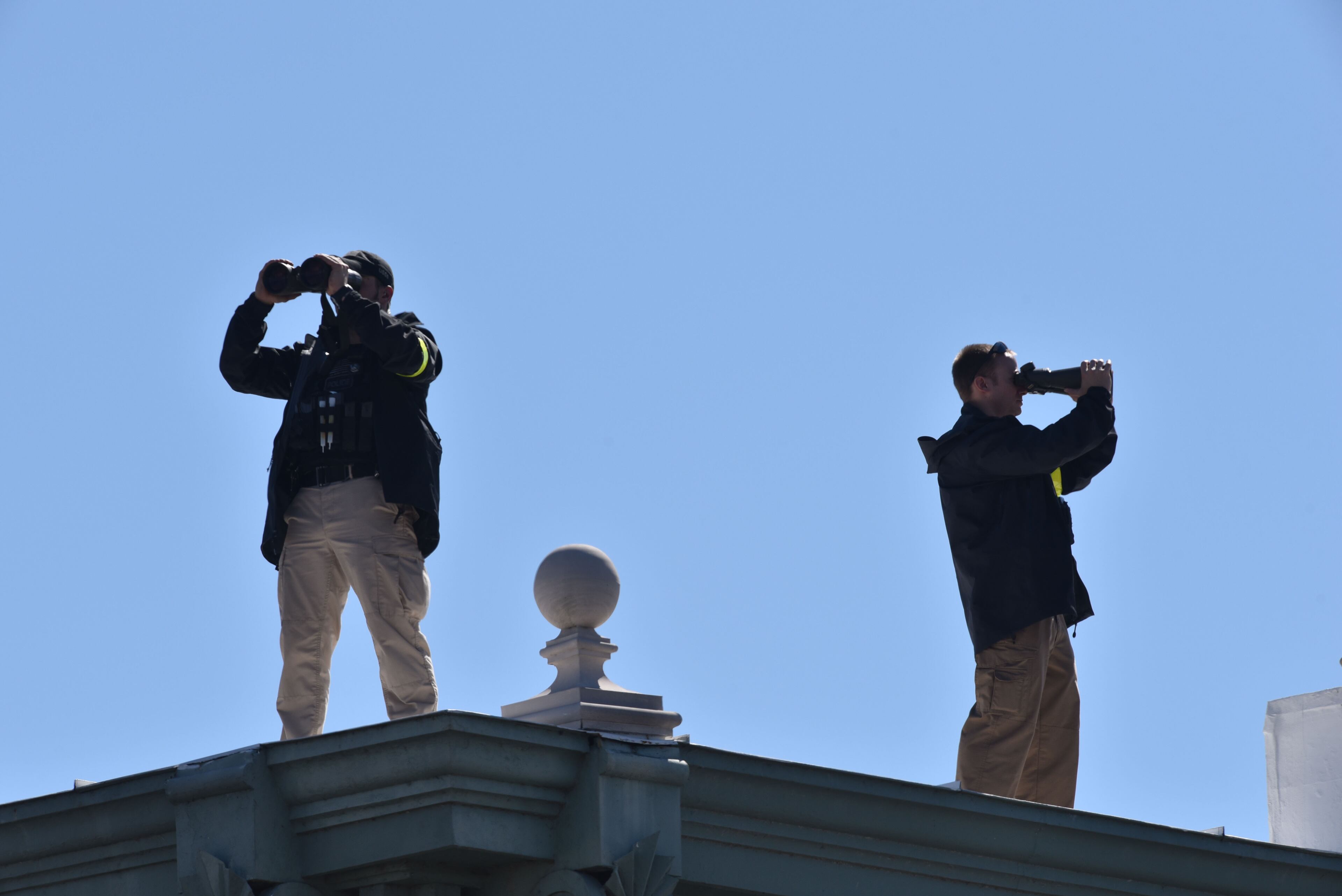 Security Service agents watch near the Edmund Pettus Bridge before a commemoration of the 50th anniversary of the historic civil rights march on Saturday, February 7, 2015. HYOSUB SHIN / HSHIN@AJC.COM