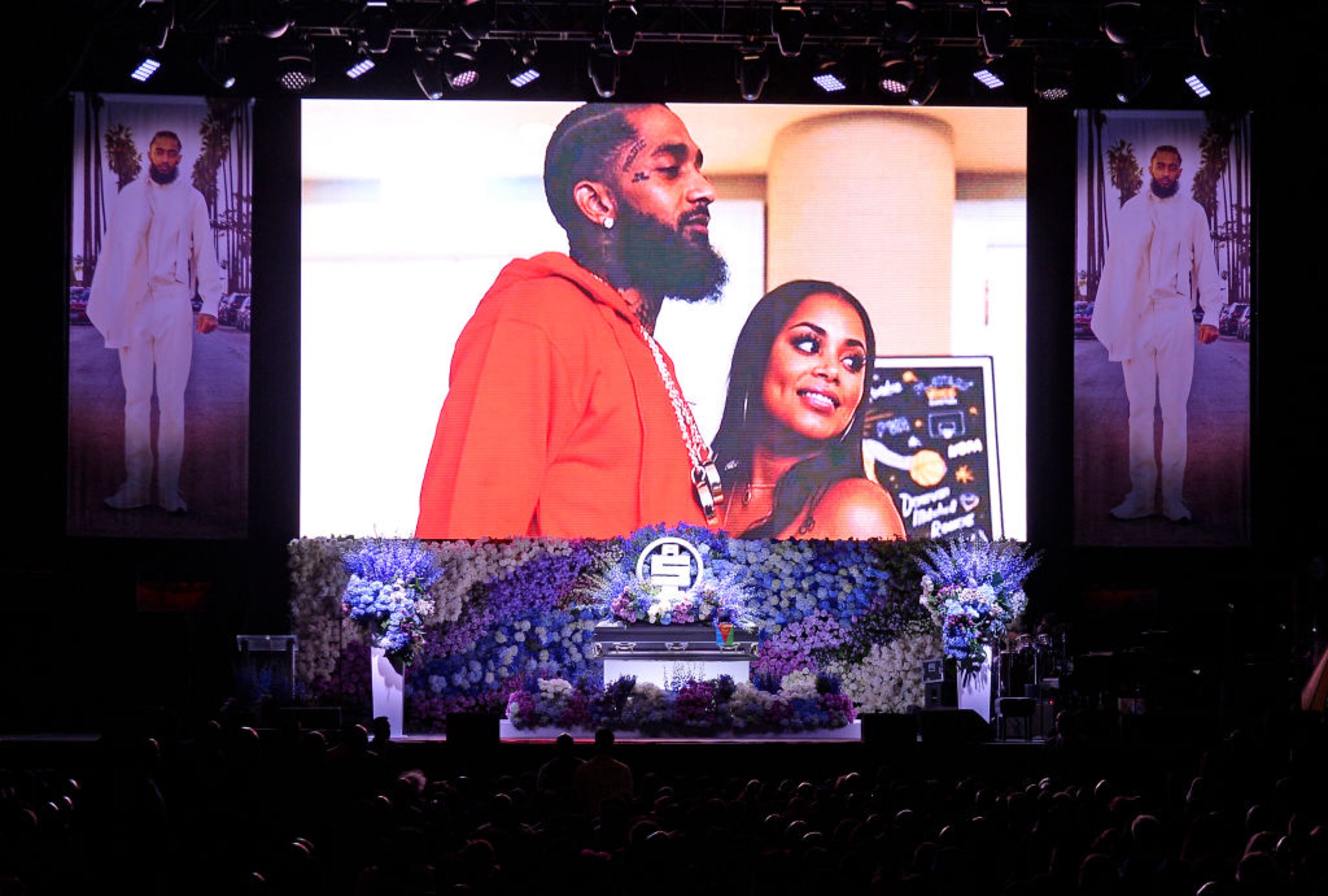 LOS ANGELES, CALIFORNIA - APRIL 11: (EDITORS NOTE: All images taken by Getty Images inside the Staples Center at Nipsey Hussle's Celebration of Life have been reviewed and approved for distribution by Atlantic Records) Photos are displayed during Nipsey Hussle's Celebration of Life at STAPLES Center on April 11, 2019 in Los Angeles, California. Nipsey Hussle was shot and killed in front of his store, The Marathon Clothing, on March 31, 2019 in Los Angeles. (Photo by Kevork Djansezian/Getty Images For Atlantic Records)