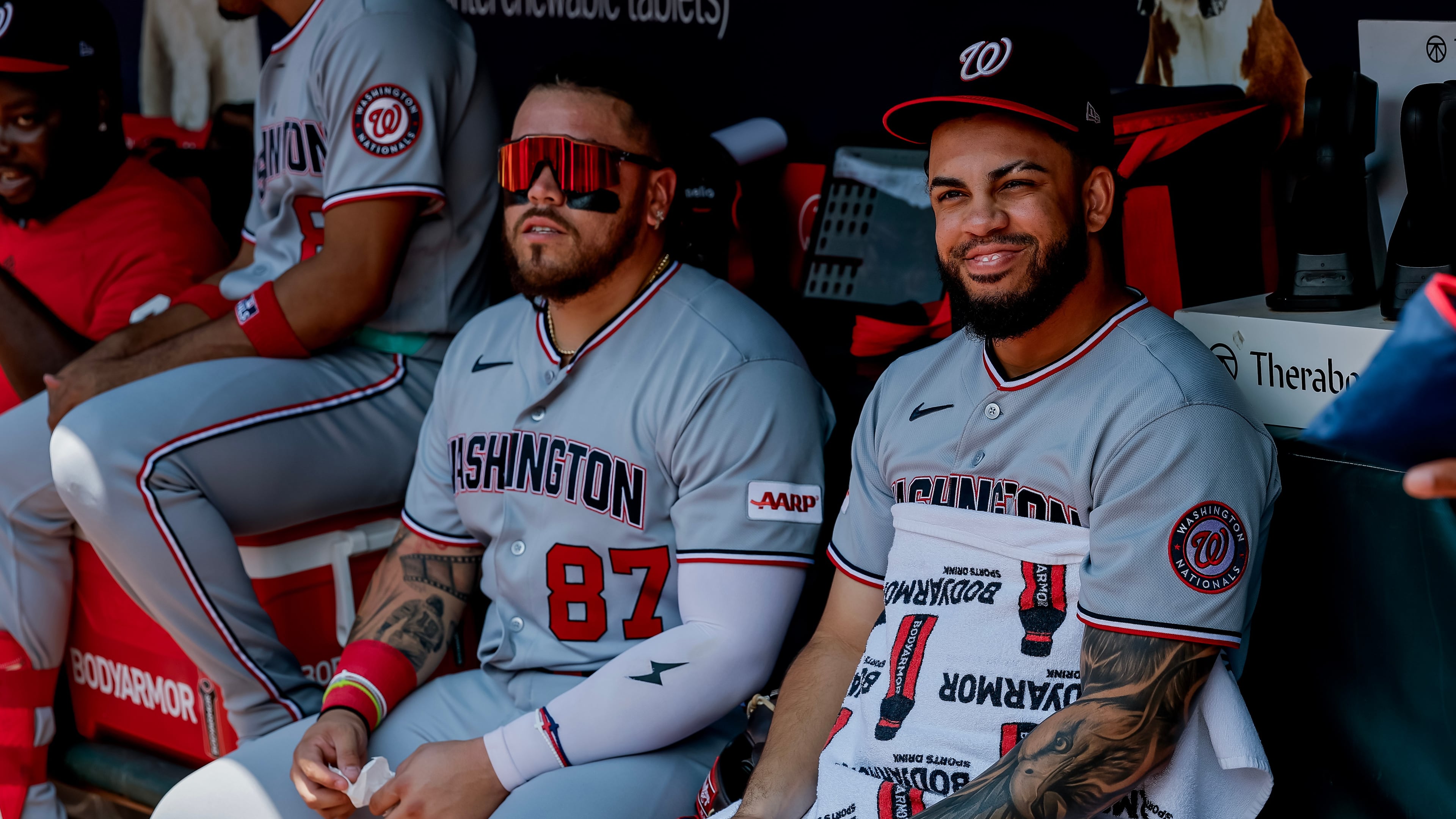 Washington Nationals' Luis García Jr., right, sits in the dugout with Andrés Chaparro (87) after he was scratched from the starting lineup before a baseball game against the Atlanta Braves, Sunday, Aug. 2, 2026, in Atlanta. (AP Photo/Erik S. Lesser)