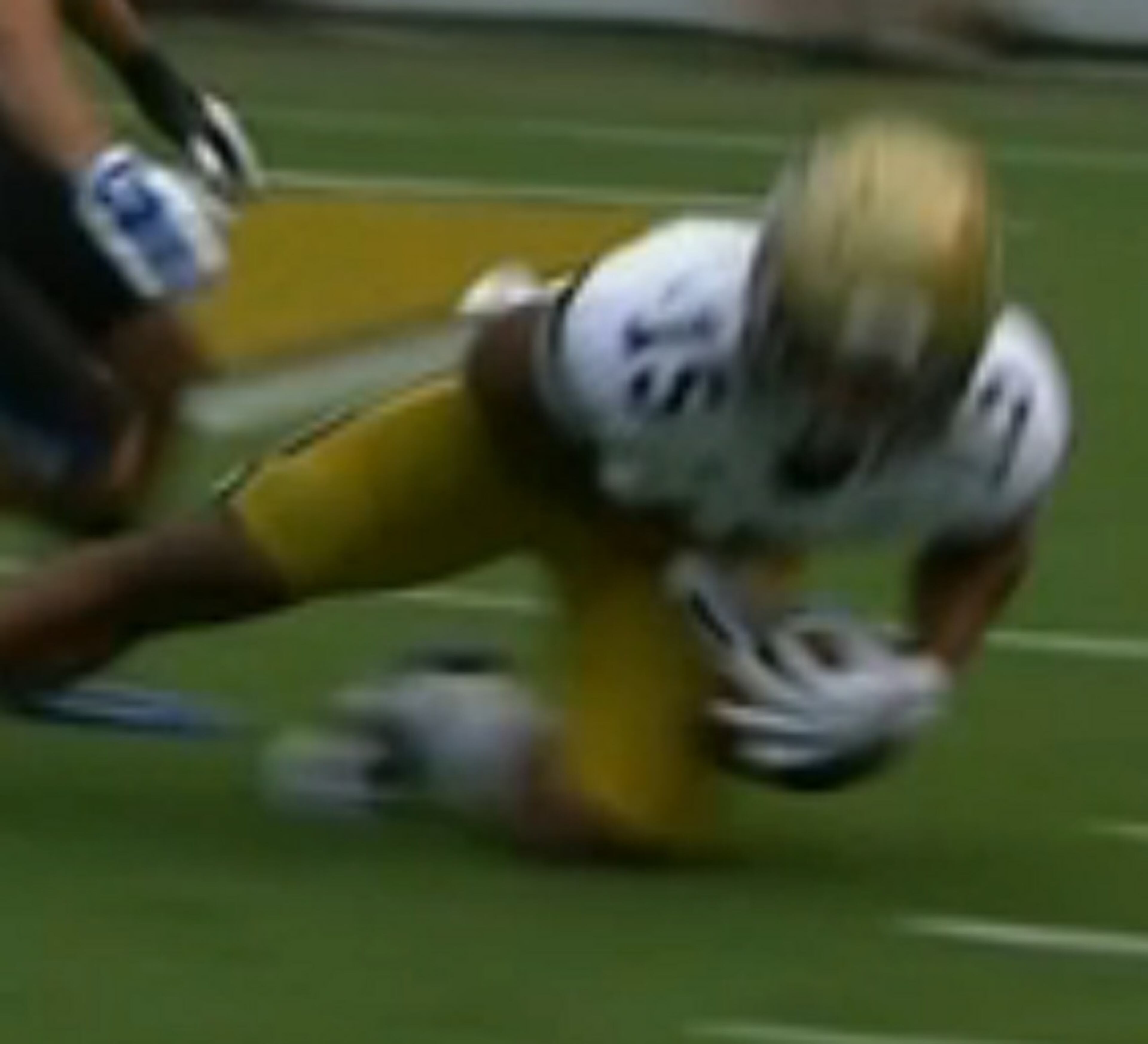 It appears Smelter's left hand is holding the ball, but not below the ball.