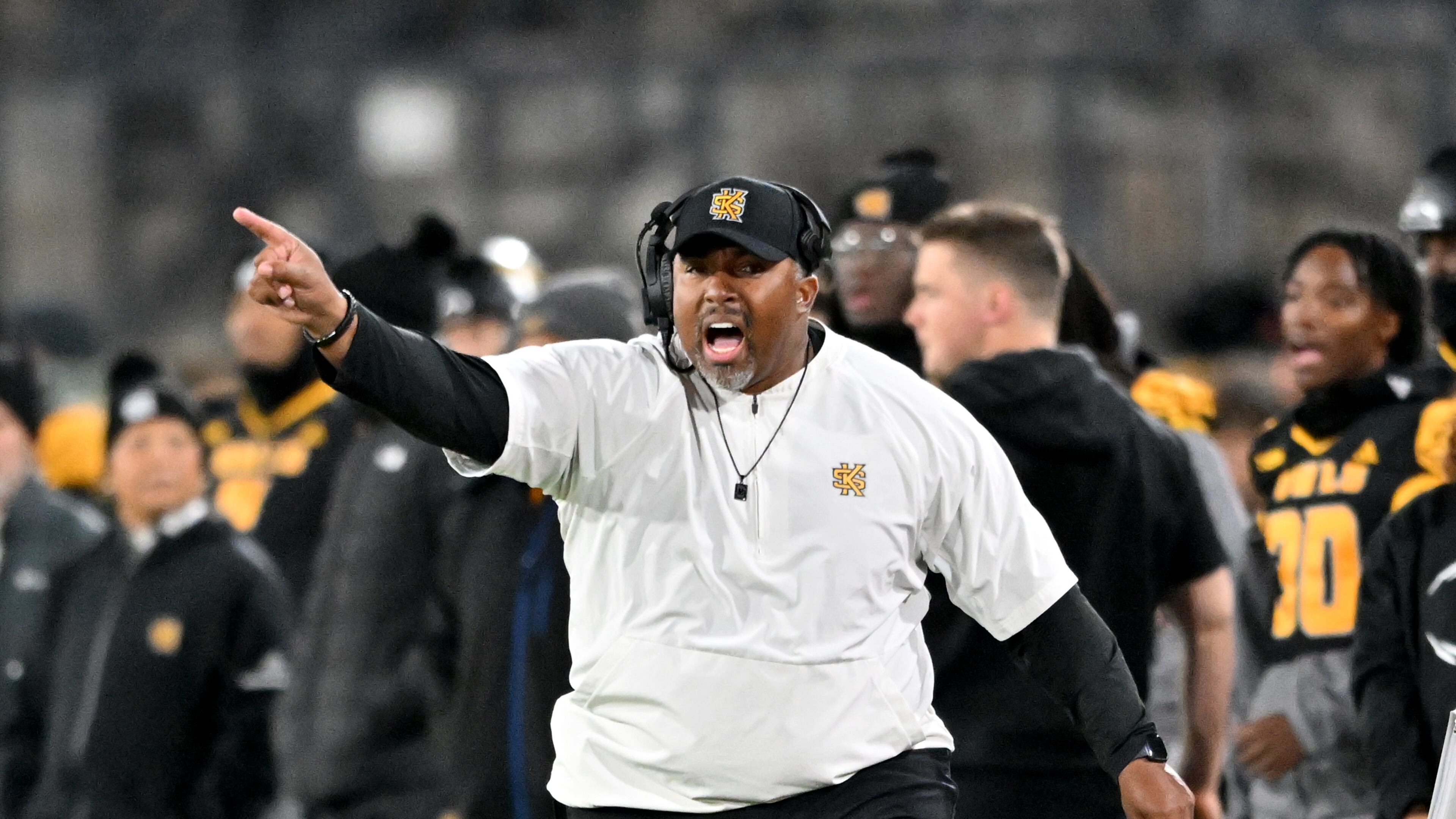 Kennesaw State head coach Jerry Mack shouts instructions during the first half in an NCAA college football game at Fifth Third Stadium, Tuesday, October 28, 2025, in Kennesaw. (Hyosub Shin/AJC)