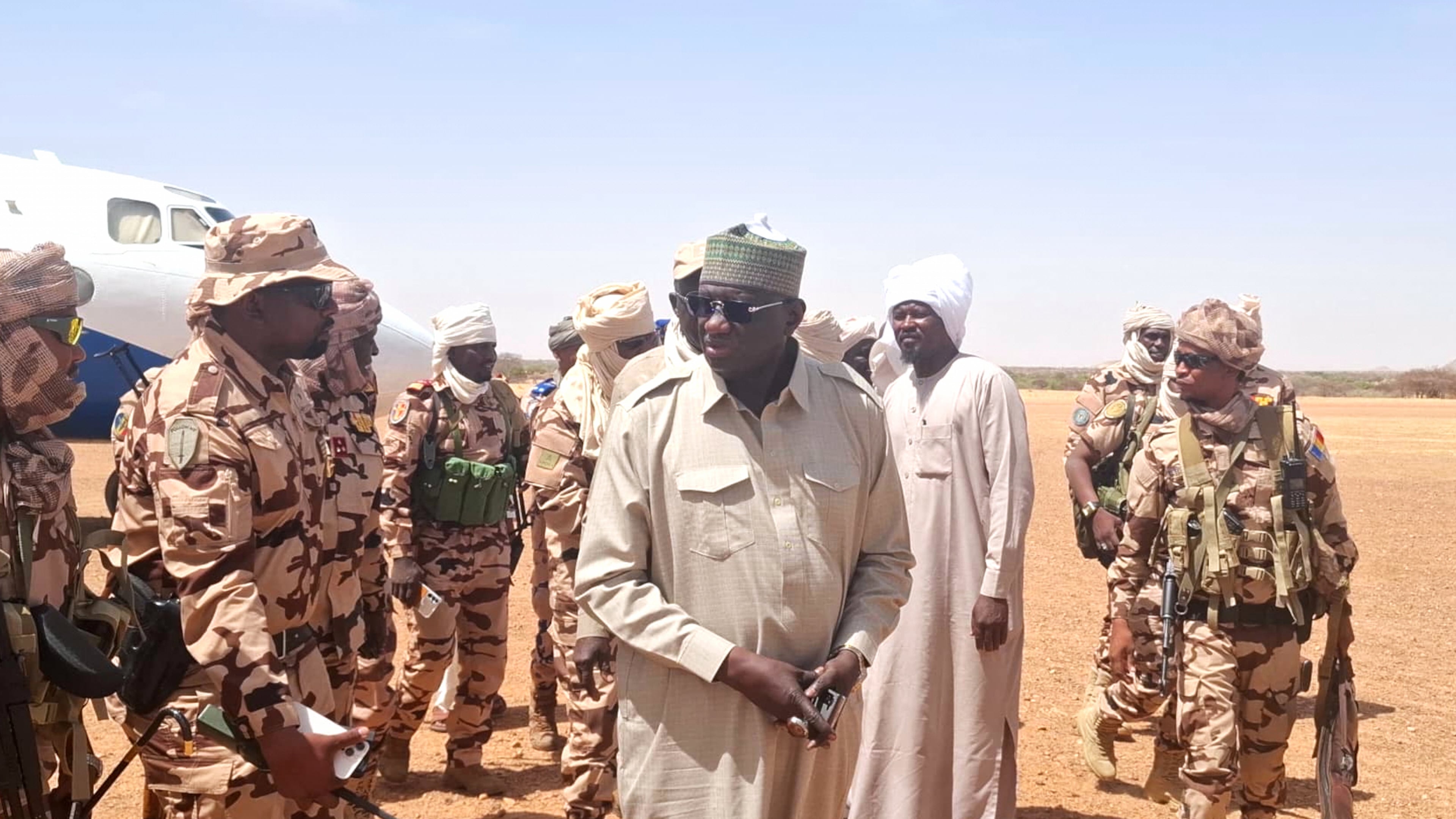In this photo release by the Chadian Press Agency, Limane Mahamat, deputy prime minister, center, arrives at Igote village following a clash between two families over a water point, in the Wadi Fira, Chad, Sunday, April 26, 2026. (Chadian Press Agency via AP)