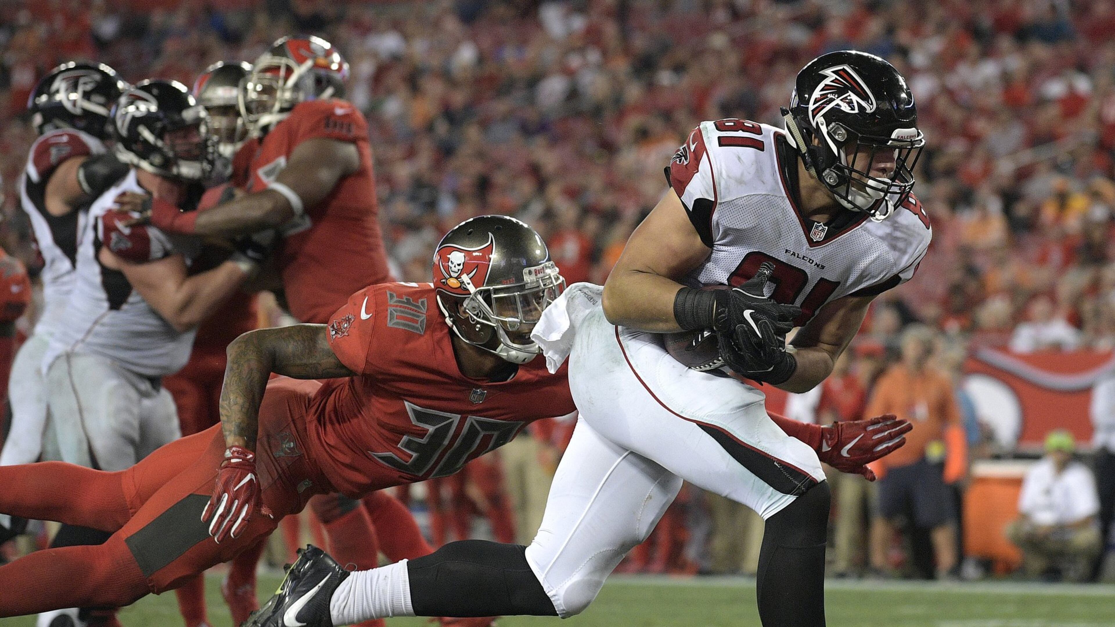 Atlanta Falcons tight end Austin Hooper (81) beats Tampa Bay Buccaneers free safety Bradley McDougald (30) on a 2-yard touchdown reception during the fourth quarter of an NFL football game Thursday, Nov. 3, 2016, in Tampa, Fla. (AP Photo/Phelan Ebenhack)