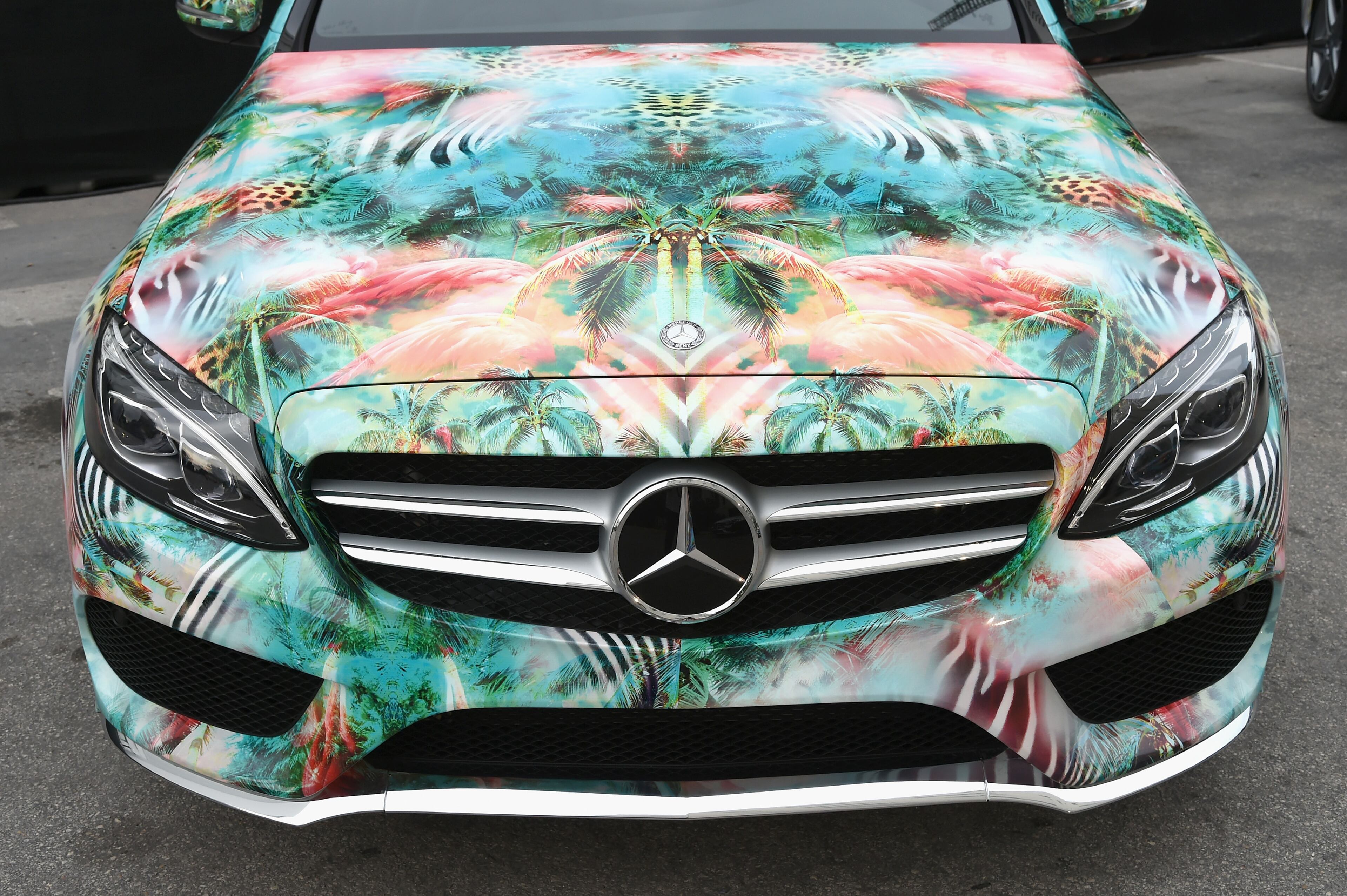 MIAMI BEACH, FL - JULY 17: A 2015 Mercedes-Benz C-Class featuring an exclusive design by Luli Fama Miami on display during Mercedes-Benz Fashion Week Swim 2015 at The Raleigh on July 17, 2014 in Miami Beach, Florida. (Photo by Andrew H. Walker/Getty Images for Mercedes-Benz Fashion Week )
