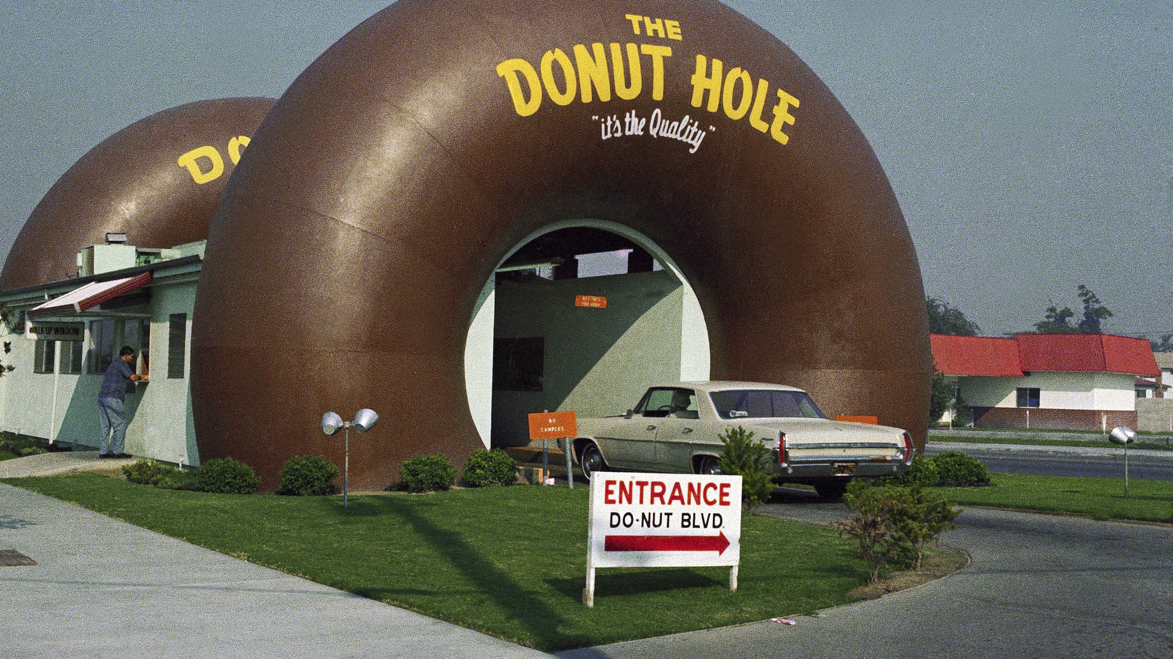 FILE - A drive-thru coffee and donut shop the Donut Hole is seen in Los Angeles in November 1970. (AP Photo/David F. Smith, File)