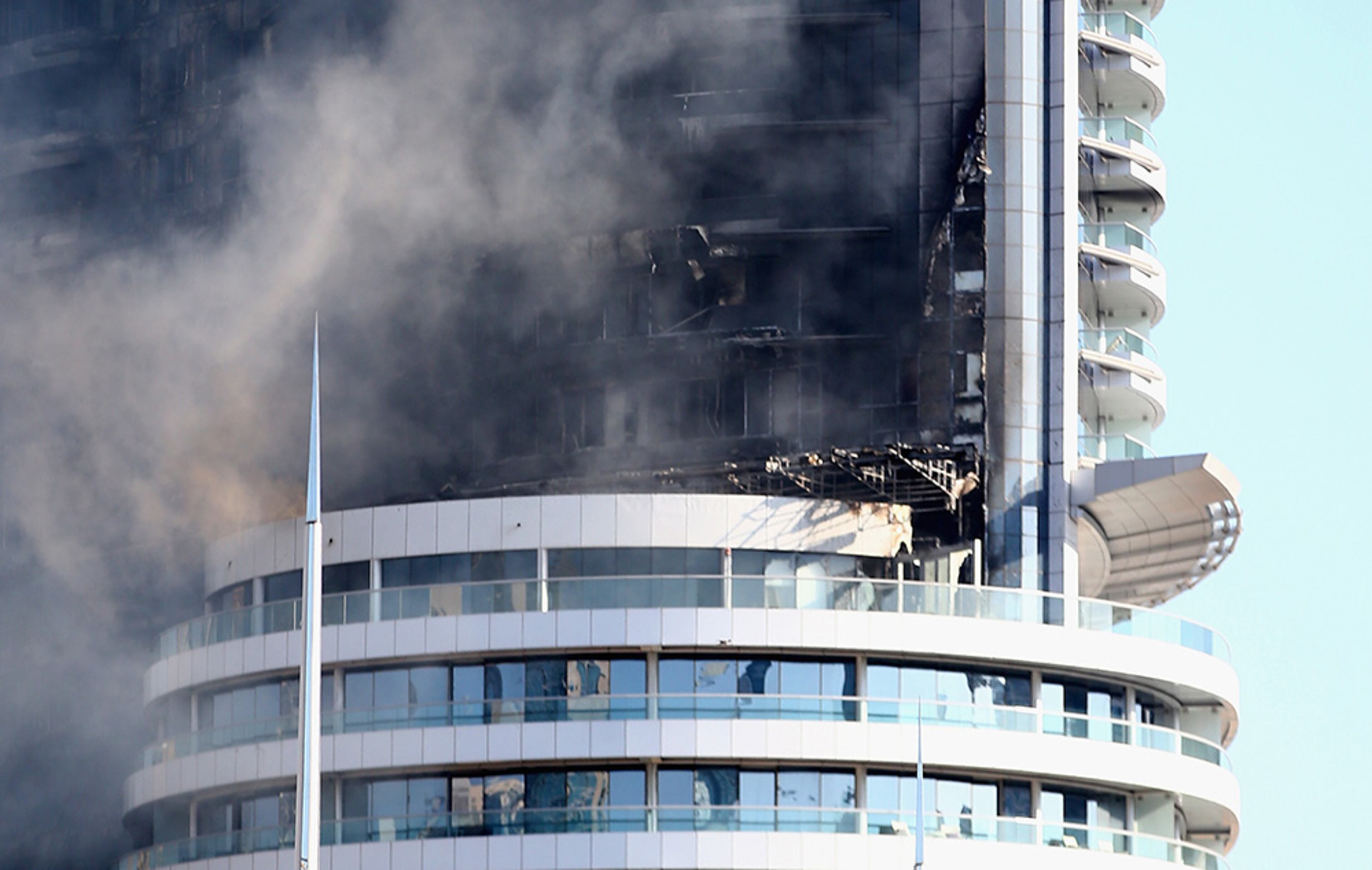 The massive fire in Dubai's Address Downtown Hotel is suspected to have started on the 20th floor of the 63-story building just hours before New Year's celebrations and spread through the outside of the structure.