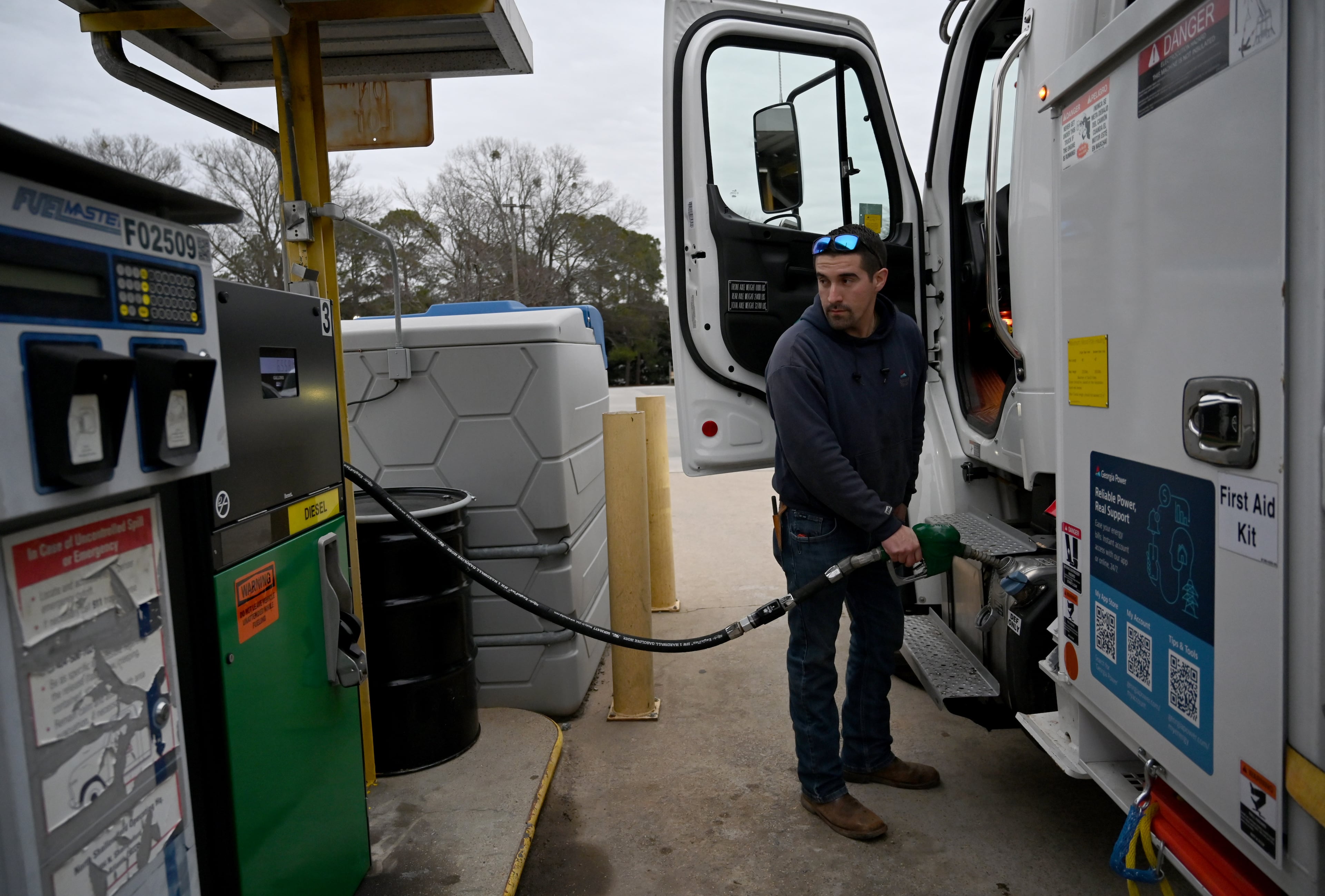 Cruz Martinez fills his truck with gas at Georgia Power North Shallowford Operating Headquarters, Saturday, Jan. 24, 2026, in Atlanta. (Hyosub Shin/AJC)