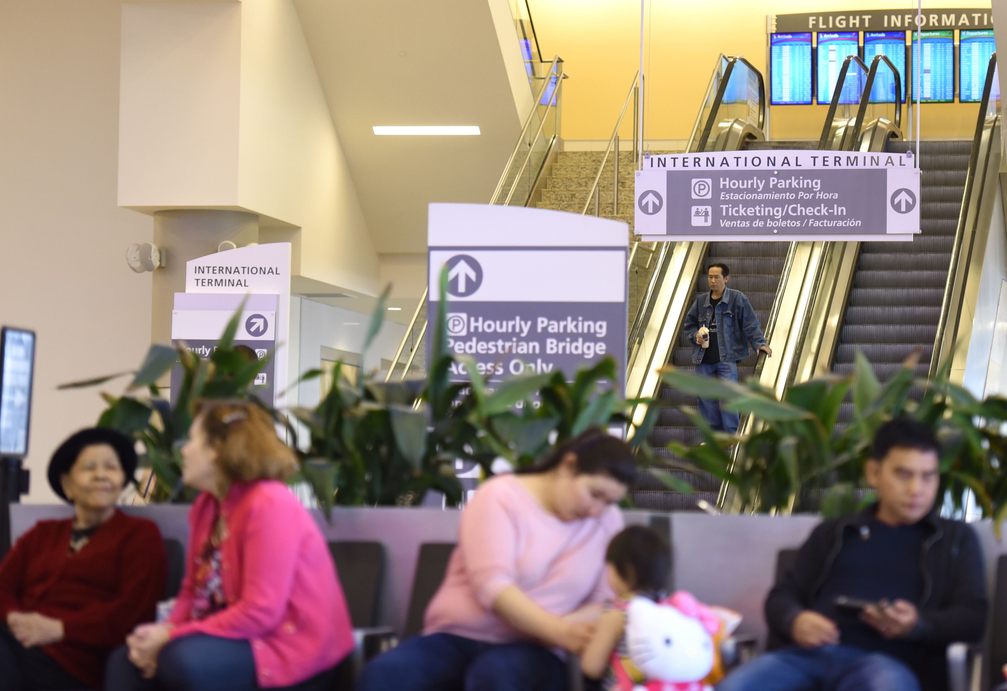 Travelers' families and friends wait at arriving area of Maynard H. Jackson Jr. International Terminal on Tuesday, March 22, 2016. Bombs exploded at the Brussels airport and one of the city's metro stations Tuesday, killing at least 31 people and wounding dozens, as a European capital was again locked down amid heightened security threats. HYOSUB SHIN / HSHIN@AJC.COM