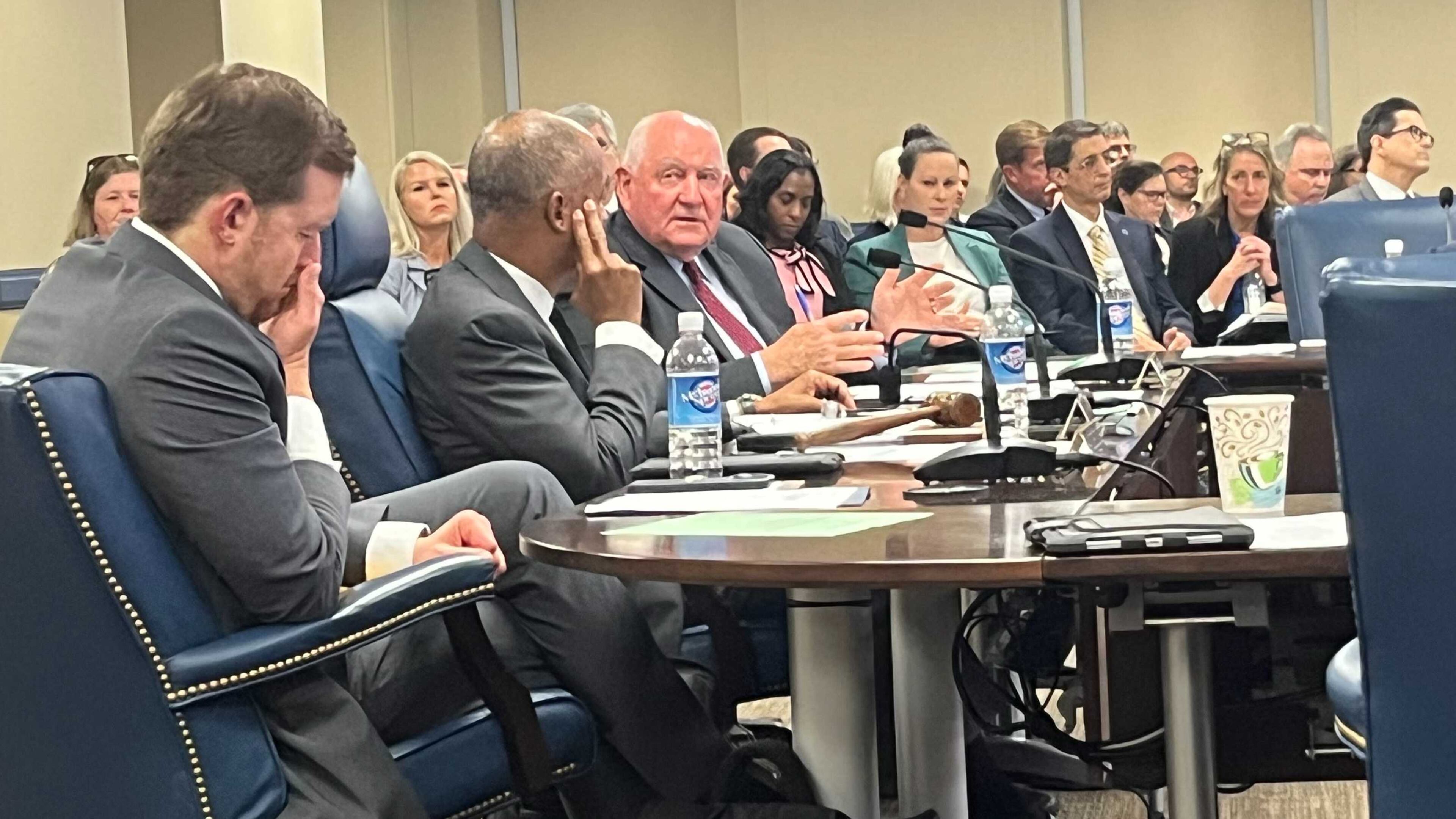 University System of Georgia Chancellor Sonny Perdue, center, listens as a group makes its case to system administrators and the state Board of Regents to divest from Israel. Perdue and the board did not make any commitments to the group. (Jason Armesto/AJC)