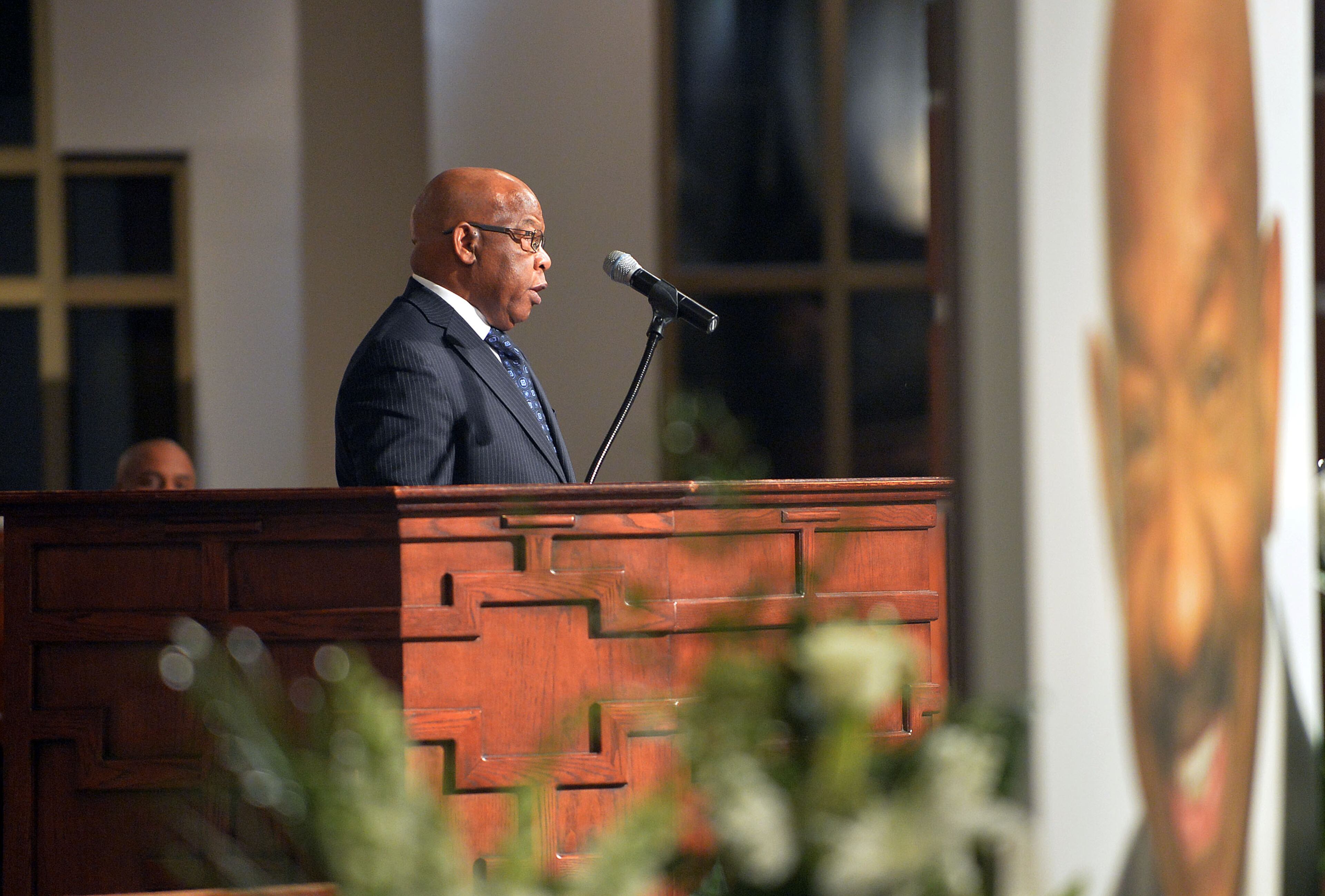 U.S. Rep. John Lewis offers a tribute during the service. Wake for Atlanta builder and civil rights leader Herman J. Russell at Ebenezer Baptist Church Friday, November 21, 2014. Among speakers scheduled were U.S. Reps. John Lewis and David Scott, and Atlanta Mayor Kasim Reed. The Rev. Jesse Jackson and Gov. Nathan Deal and his wife Sandra also attended the service. KENT D. JOHNSON/KDJOHNSON@AJC.COM