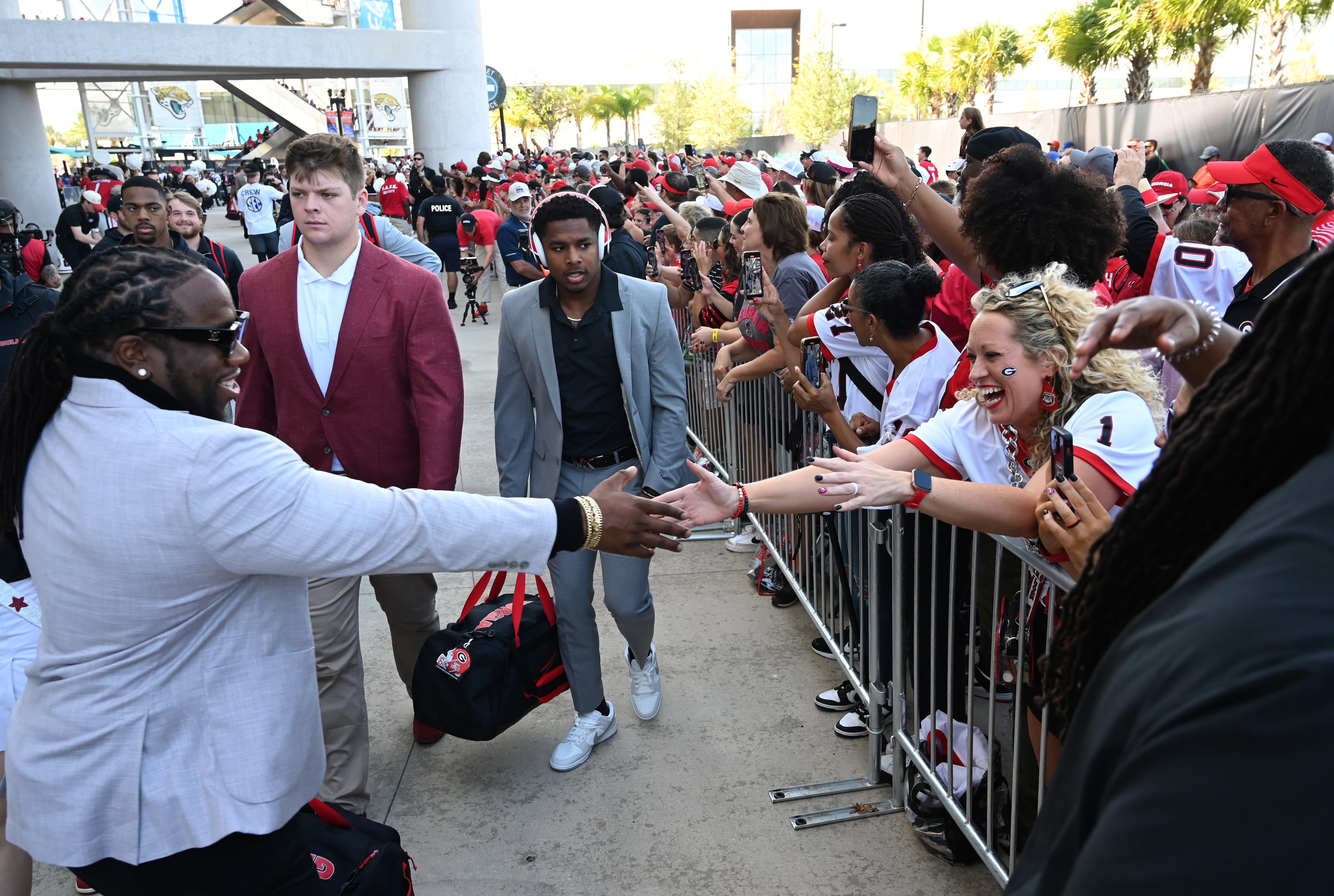 Georgia fans cheer as players and staff arrive during Dawgs Walk before the NCAA football game between Georgia and Florida at EverBank Stadium, Saturday, November 2, 2024, in Jacksonville, Fla. (Hyosub Shin / AJC)