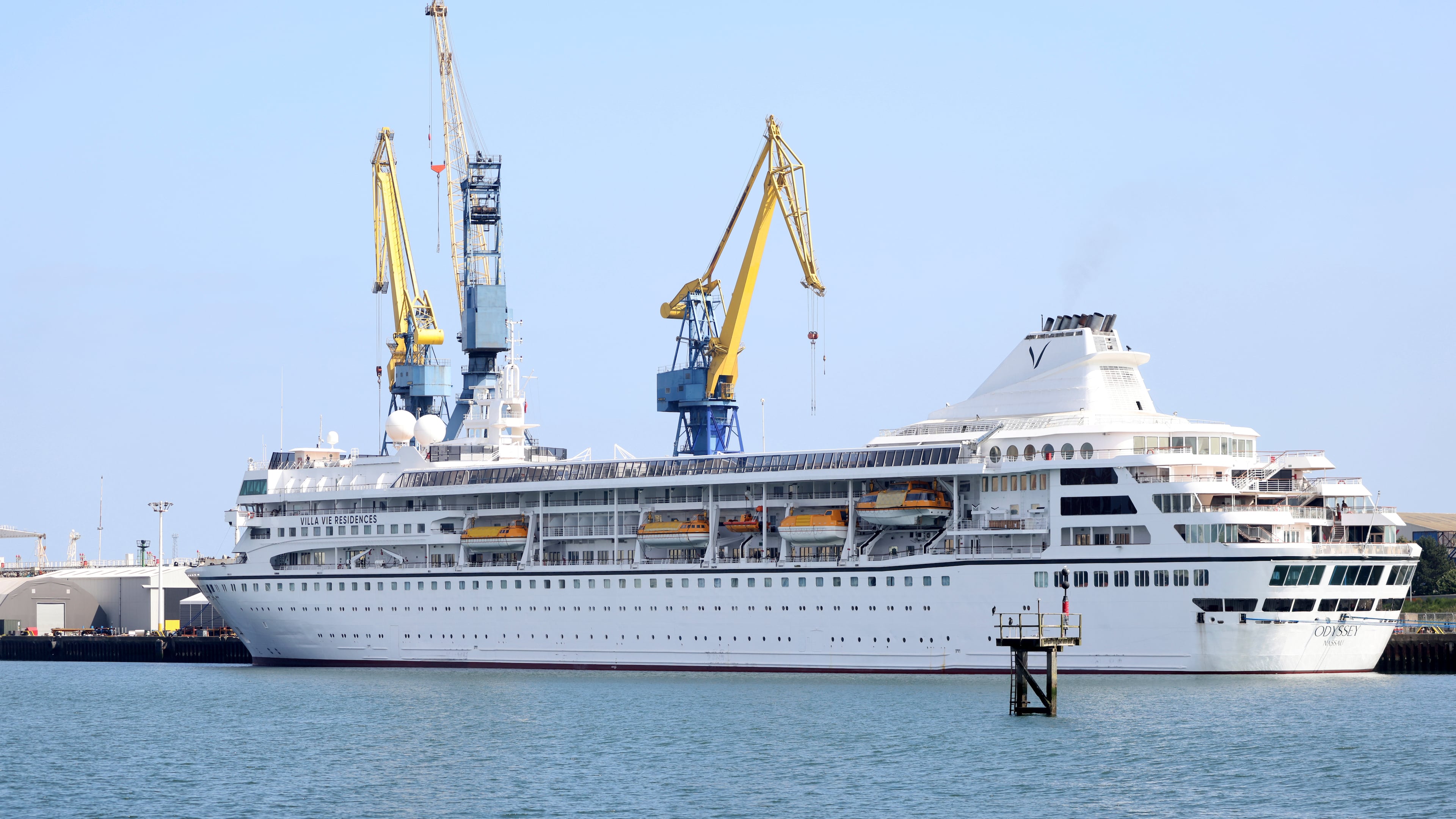 FILE - The Odyssey, a U.S. cruise liner operated by Villa Vie Residences is docked at Harland & Wolf ship repair facility in Belfast Harbour, Northern Ireland, on Aug. 30, 2024. (AP Photo/Peter Morrison, File)