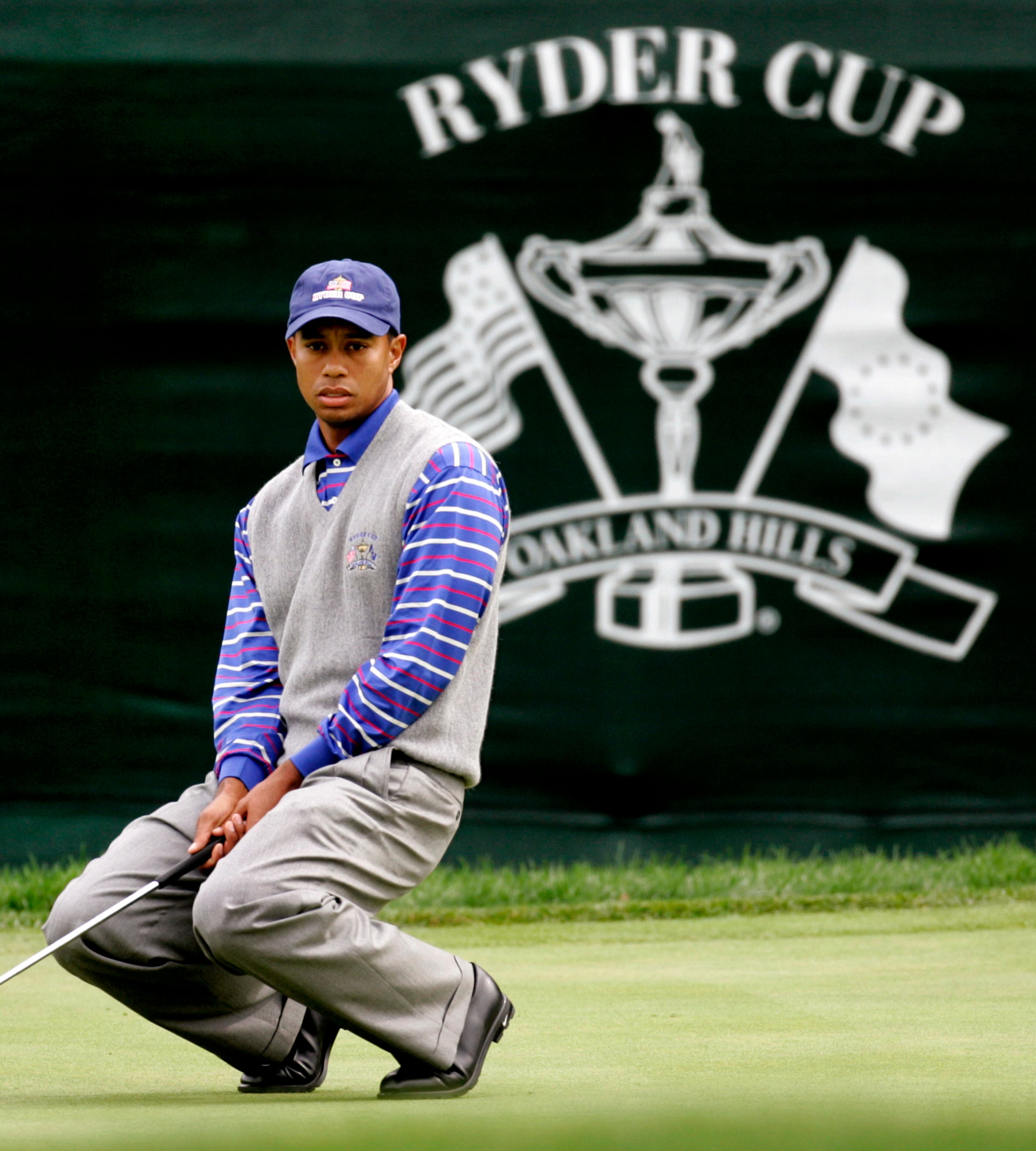 U.S. team member Tiger Woods reacts to a missed birdie on the fifth hole of his foursomes match at the 35th Ryder Cup matches at Oakland Hills Country Club in Bloomfield Township, Mich., on Friday, Sept. 17, 2004. (AP Photo/Dave Martin)