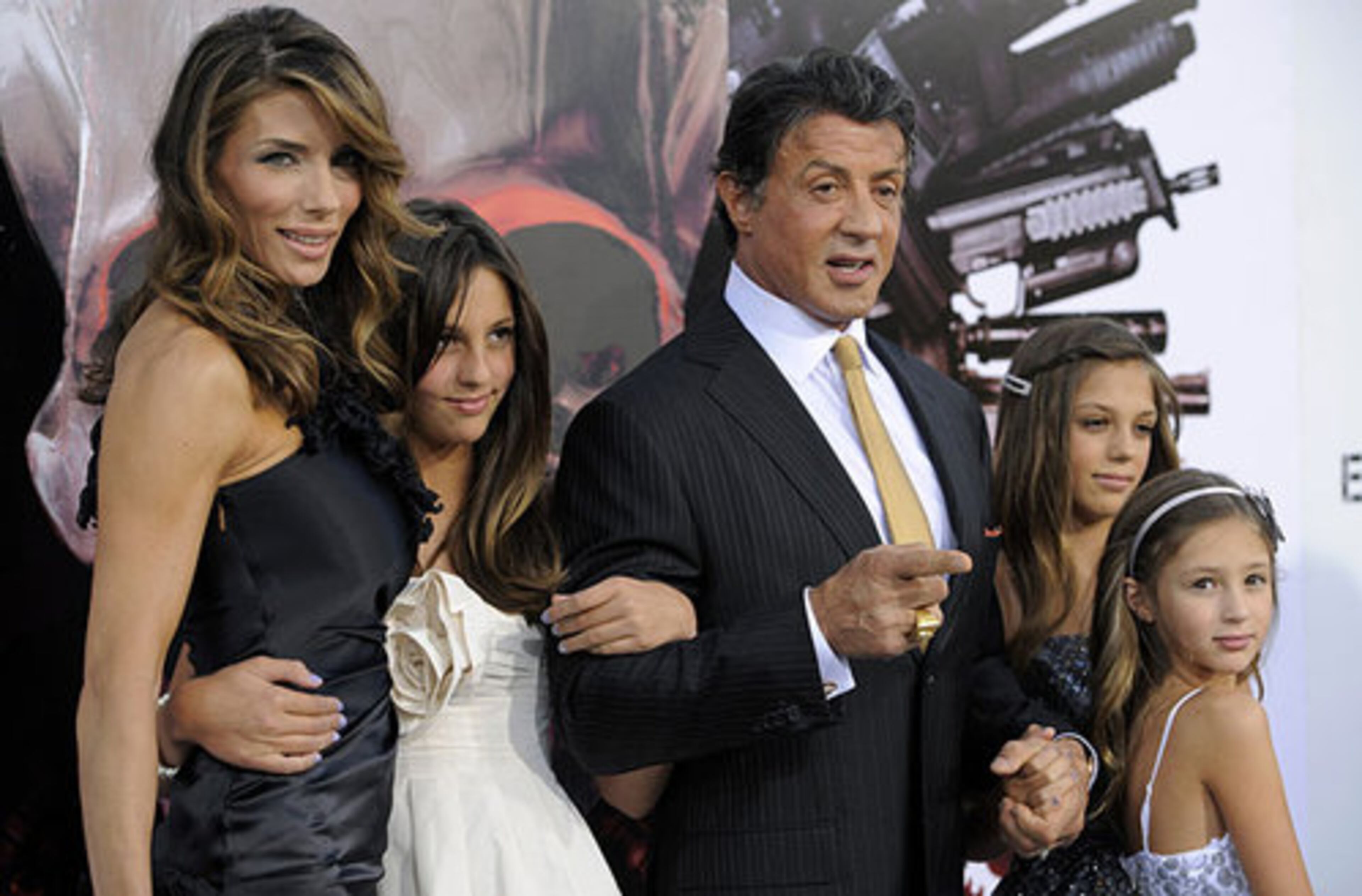 Sylvester Stallone, star of "The Expendables, " poses with his wife Jennifer Flavin and their daughters, from left, Sophia Rose, Sistine Rose and Scarlet Rose at the premiere of the film in Los Angeles.