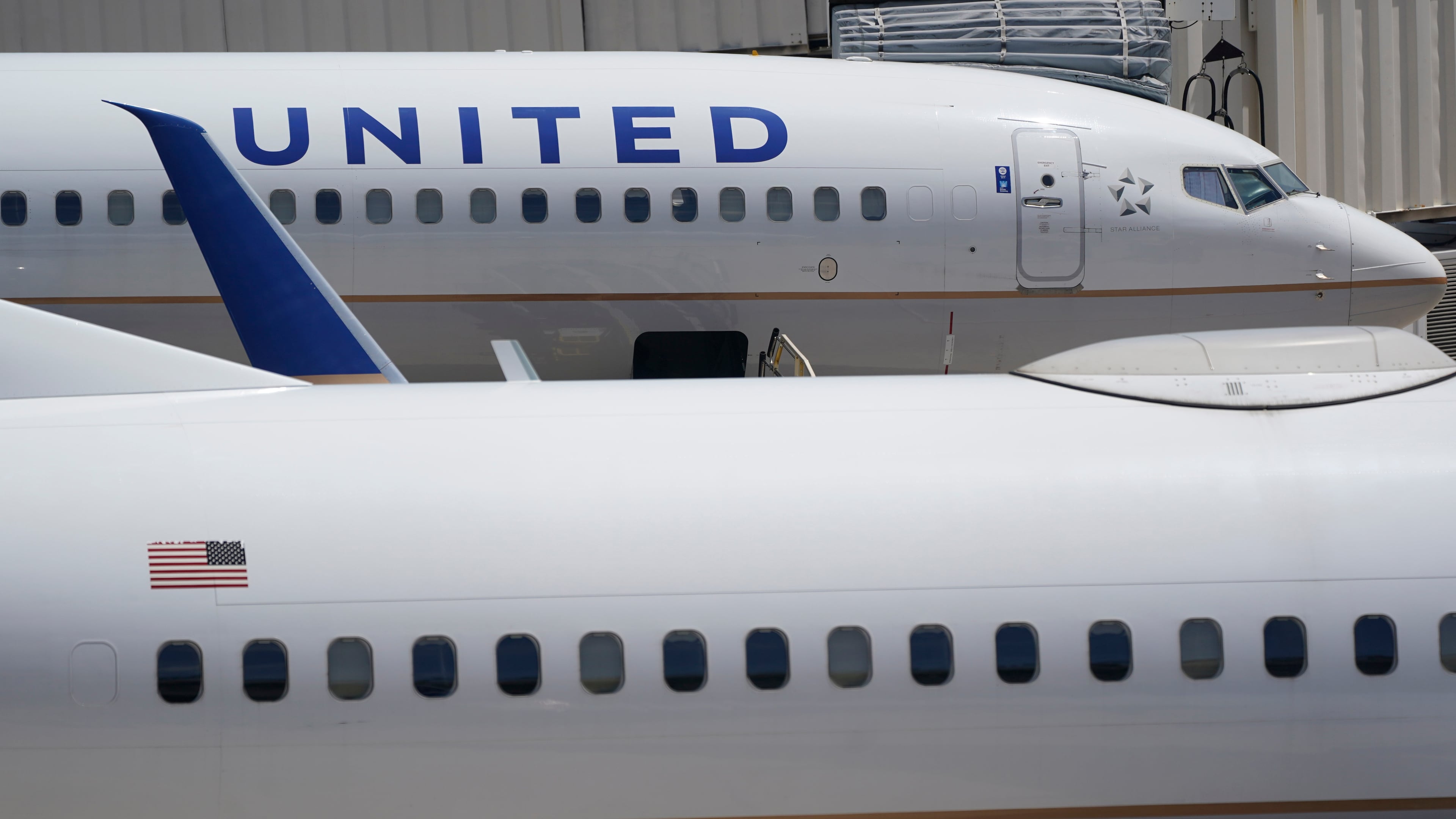 FILE - Two United Airlines Boeing 737s are shown parked at the gate, July 7, 2022, at the Fort Lauderdale-Hollywood International Airport in Fort Lauderdale, Fla. (AP Photo/Wilfredo Lee, File)WLD
