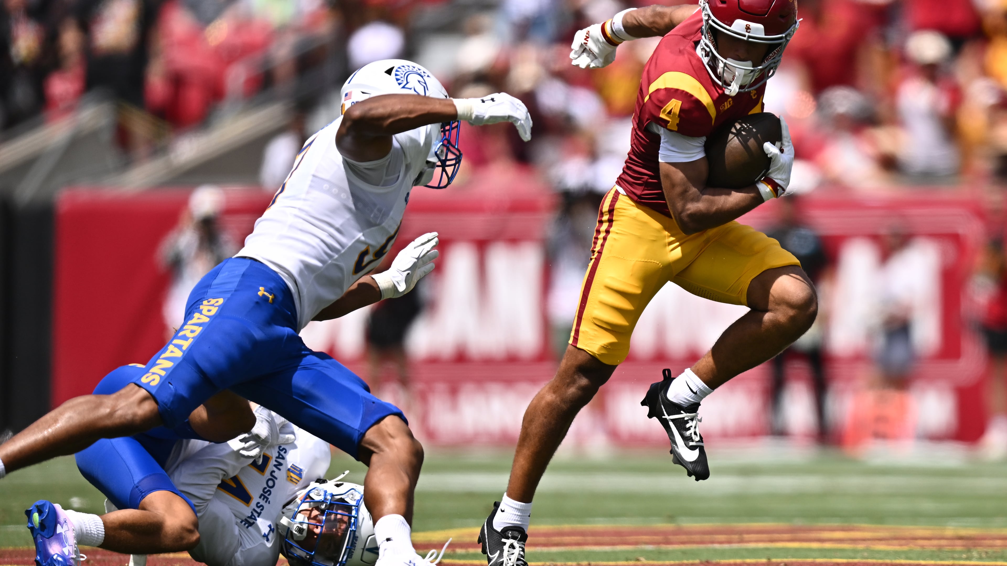 Southern California wide receiver Trent Mosley (4) runs with the ball during the first half of an NCAA college football game against San Jose State, Saturday, Aug. 29, 2026, in Los Angeles. (AP Photo/William Liang)