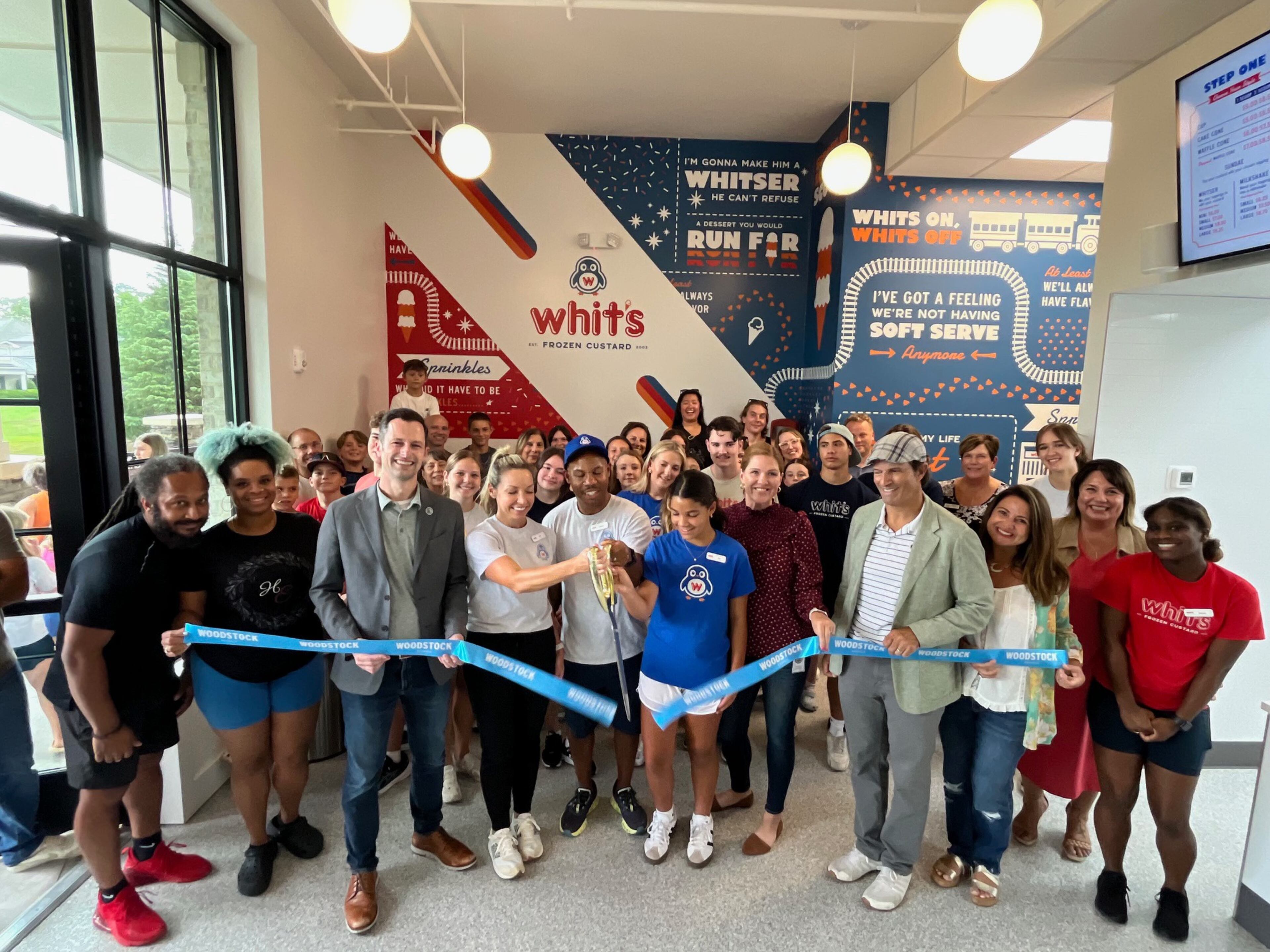 The ribbon cutting ceremony at Whit's Frozen Custard in downtown Woodstock. (Courtesy of Whit's Frozen Custard)