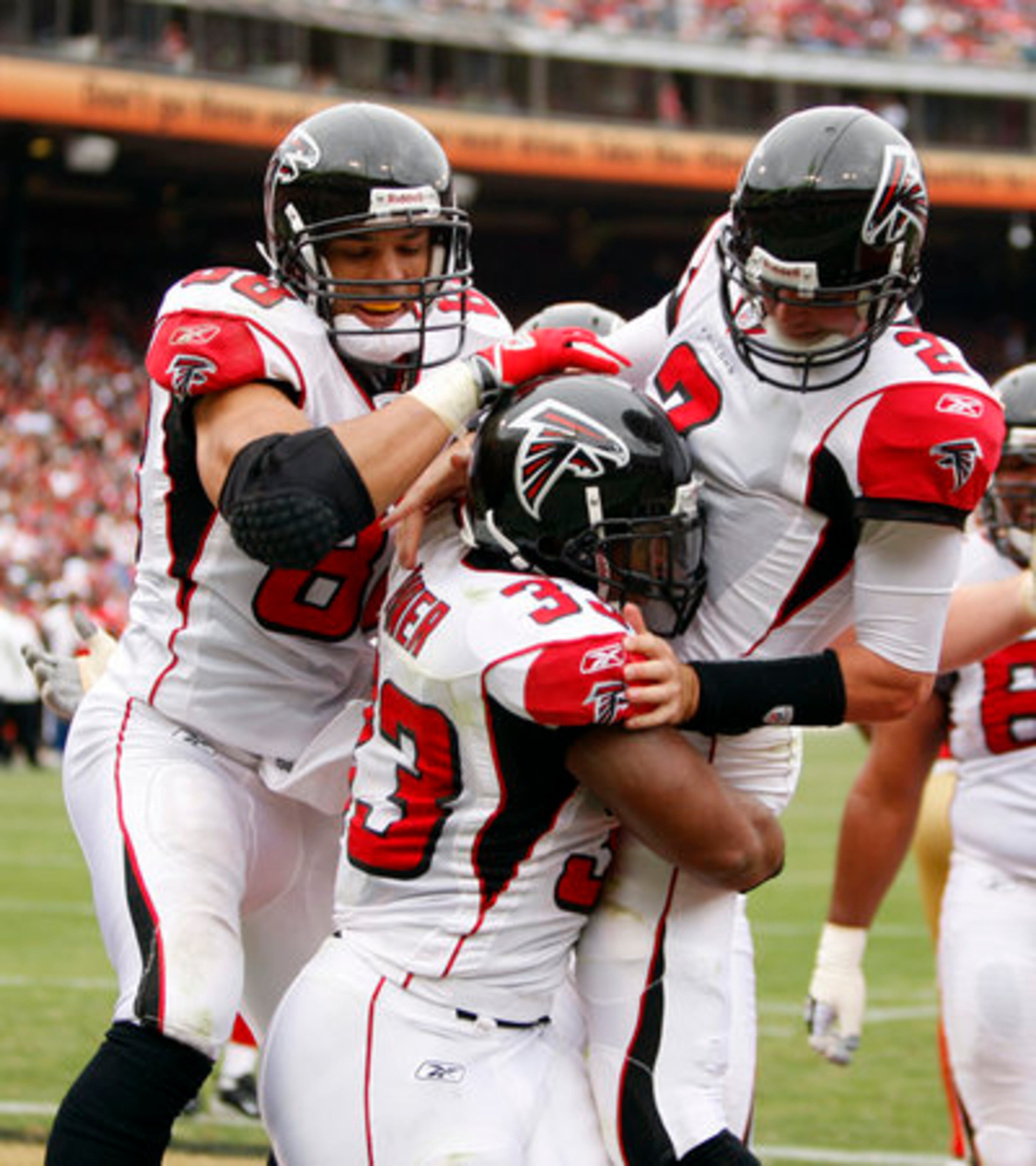 Falcons quarterback Matt Ryan (2) celebrates a touchdown with teammates Michael Turner (33) and Tony Gonzalez. Falcons set a franchise record with a 35-point half in 45-10 win over San Francisco.