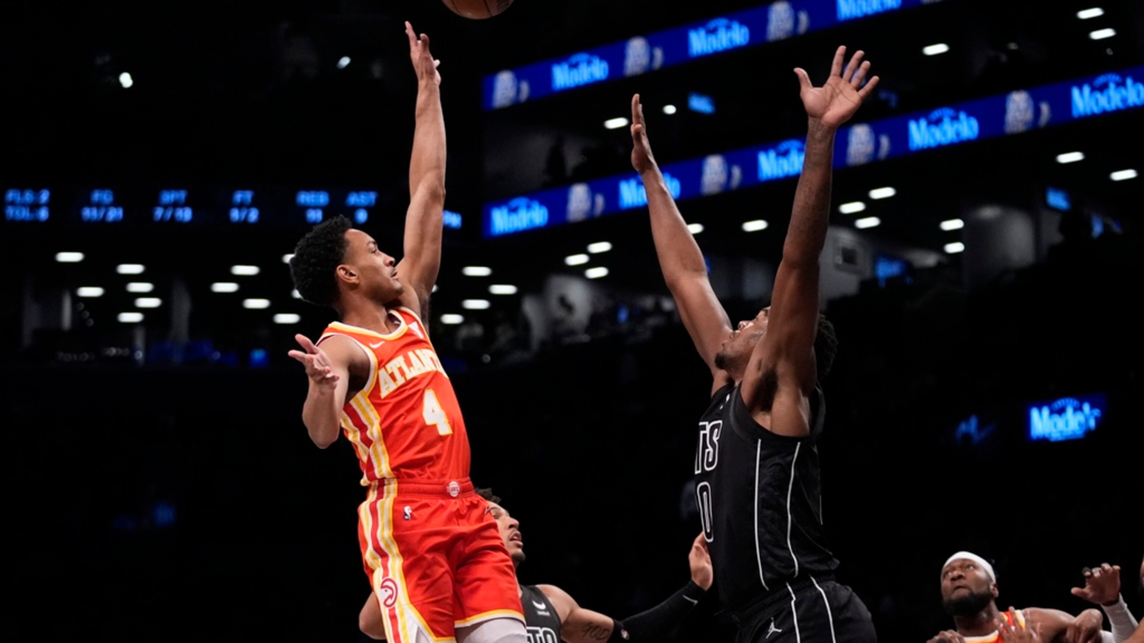 Atlanta Hawks' Kobe Bufkin (4) shoots over Brooklyn Nets' Day'Ron Sharpe (20) during the first half of an NBA basketball game Thursday, Feb. 29, 2024, in New York. (AP Photo/Frank Franklin II)