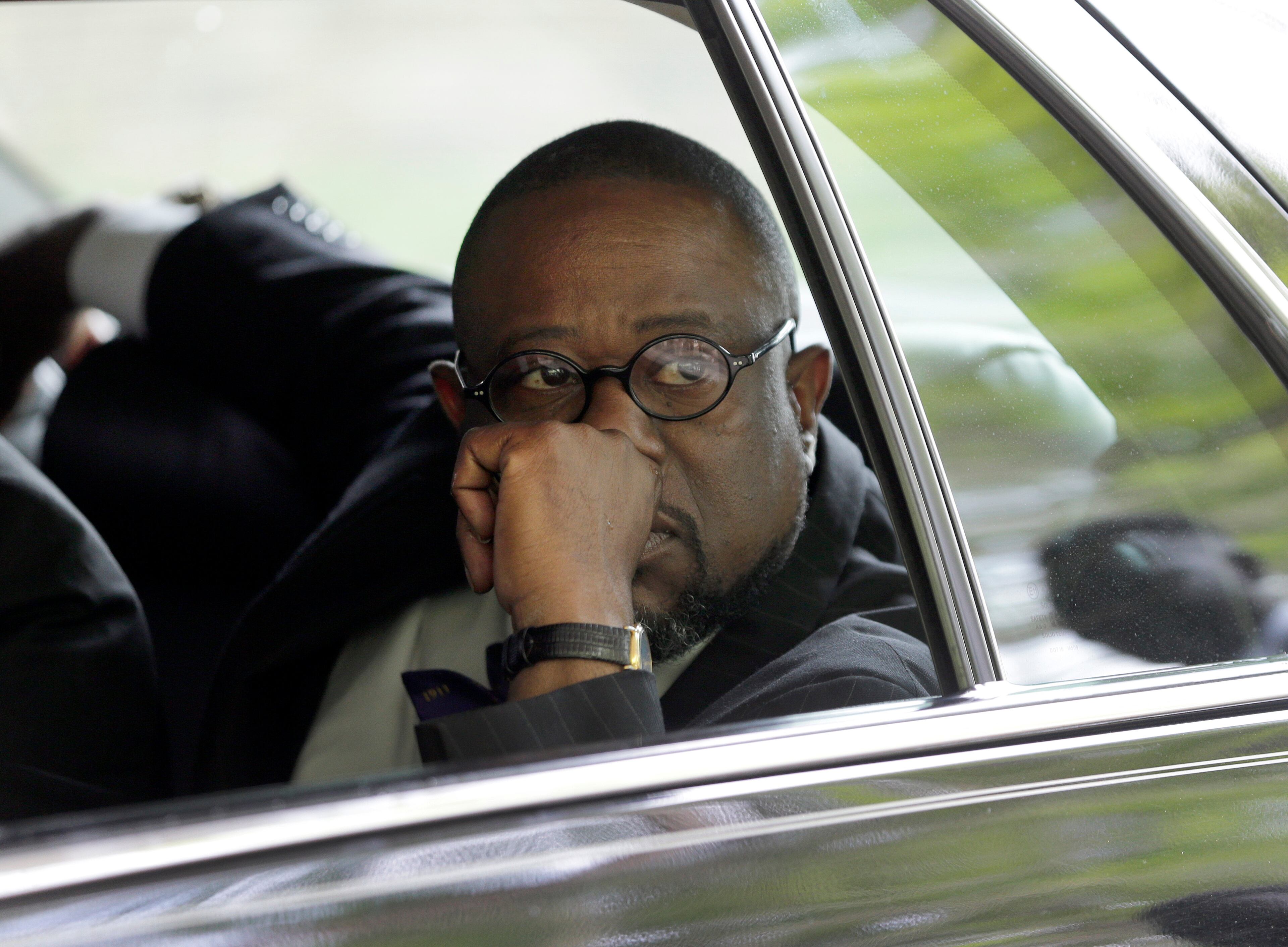 Anthony Scott, brother of Walter Scott, looks out a car window before leaving the World Outreach Revival Deliverance Ministries Christian Center after the funeral service in Summerville, S.C. on Saturday, April 11, 2015. Walter Scott was fatally shot a week earlier by a North Charleston police officer after a traffic stop. Officer Michael Slager has been charged with murder. (AP Photo/Chuck Burton)