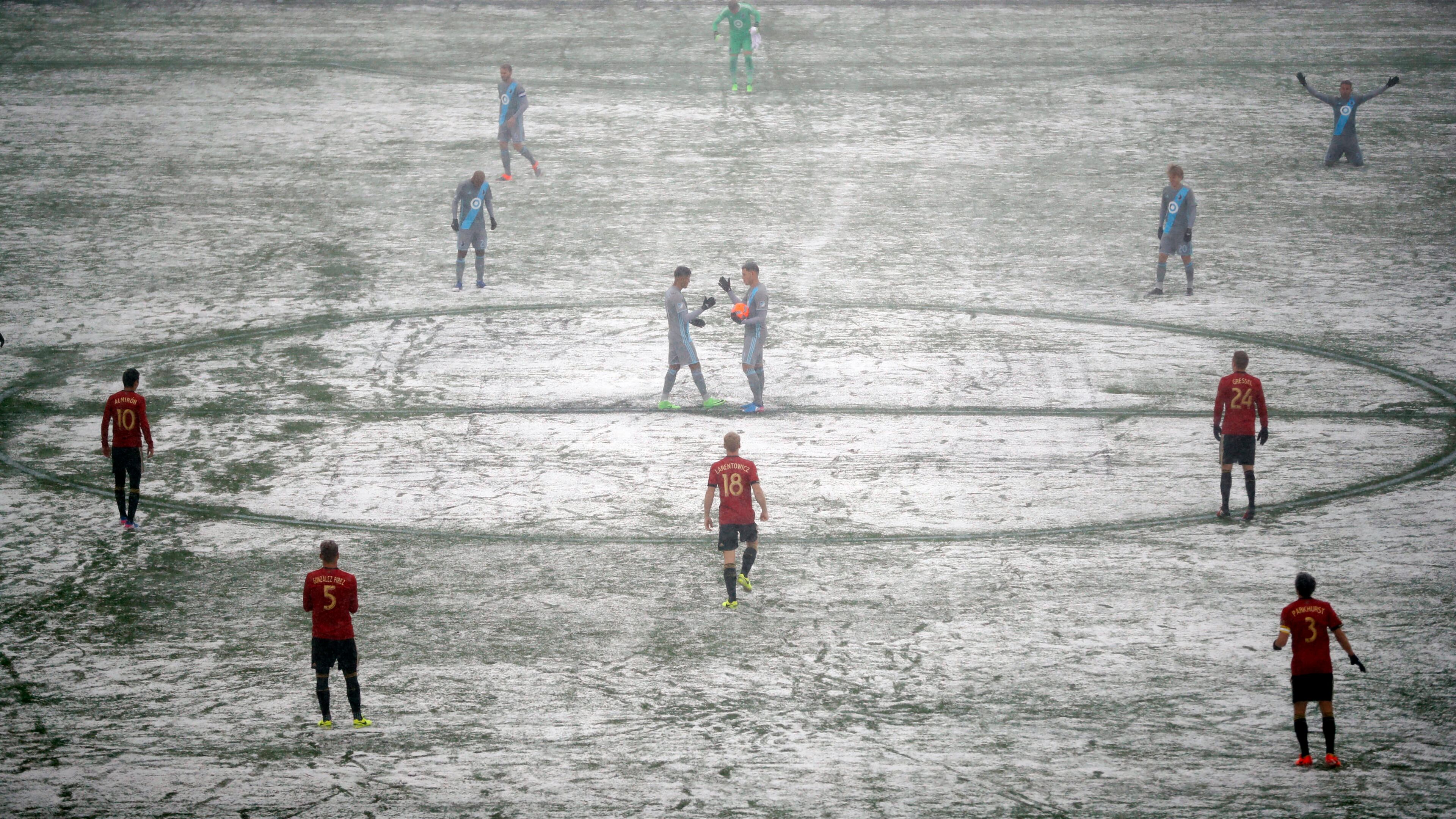 Atlanta United and Minnesota United prepare for an MLS soccer game as a grounds crew worker clear lines Sunday, March 12, 2017, in Minneapolis, Minn. (Jeff Wheeler/Star Tribune via AP)