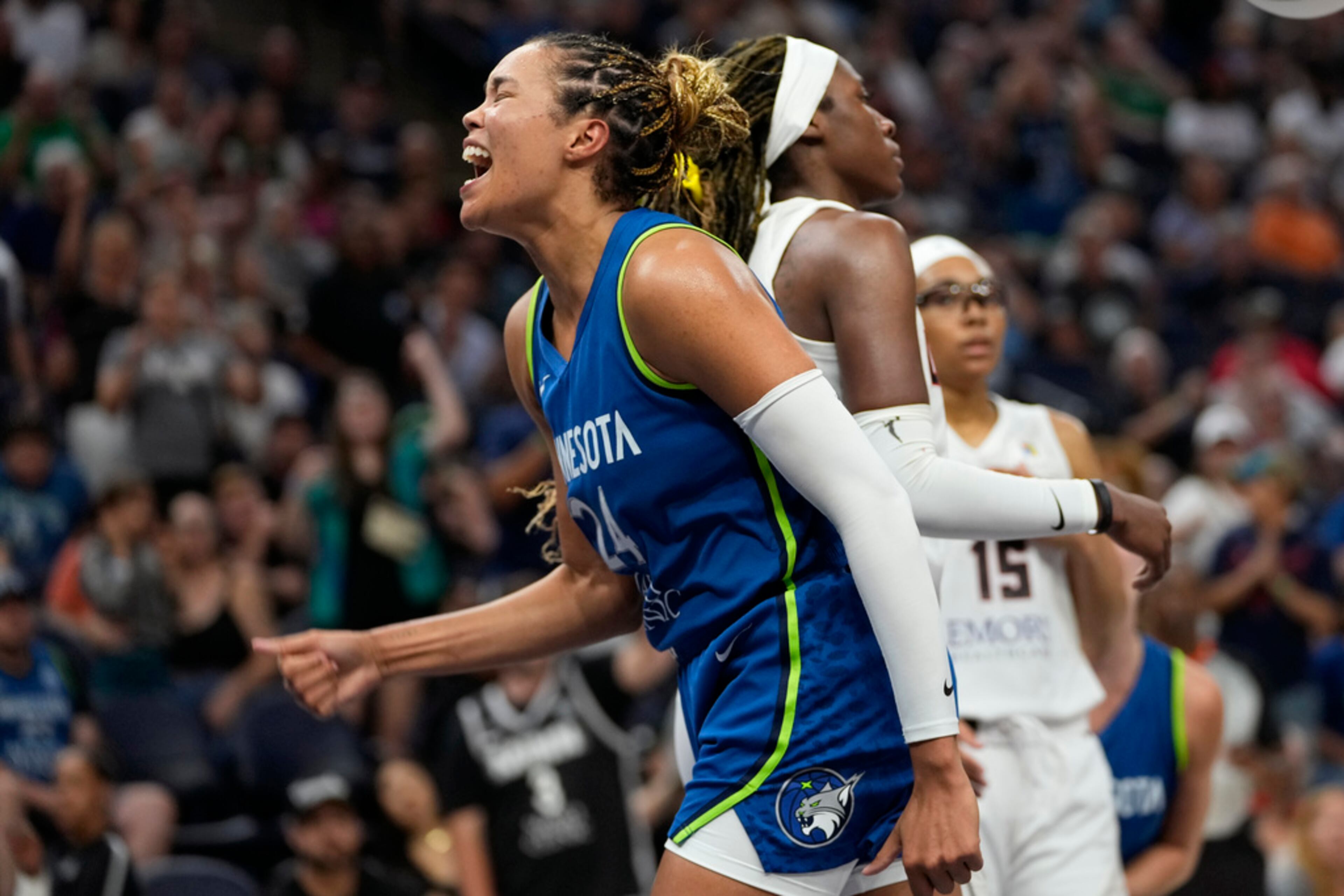 Minnesota Lynx forward Napheesa Collier celebrates after making a basket while fouled during overtime of a WNBA basketball game against the Atlanta Dream, Friday, Sept. 1, 2023, in Minneapolis. (AP Photo/Abbie Parr)
