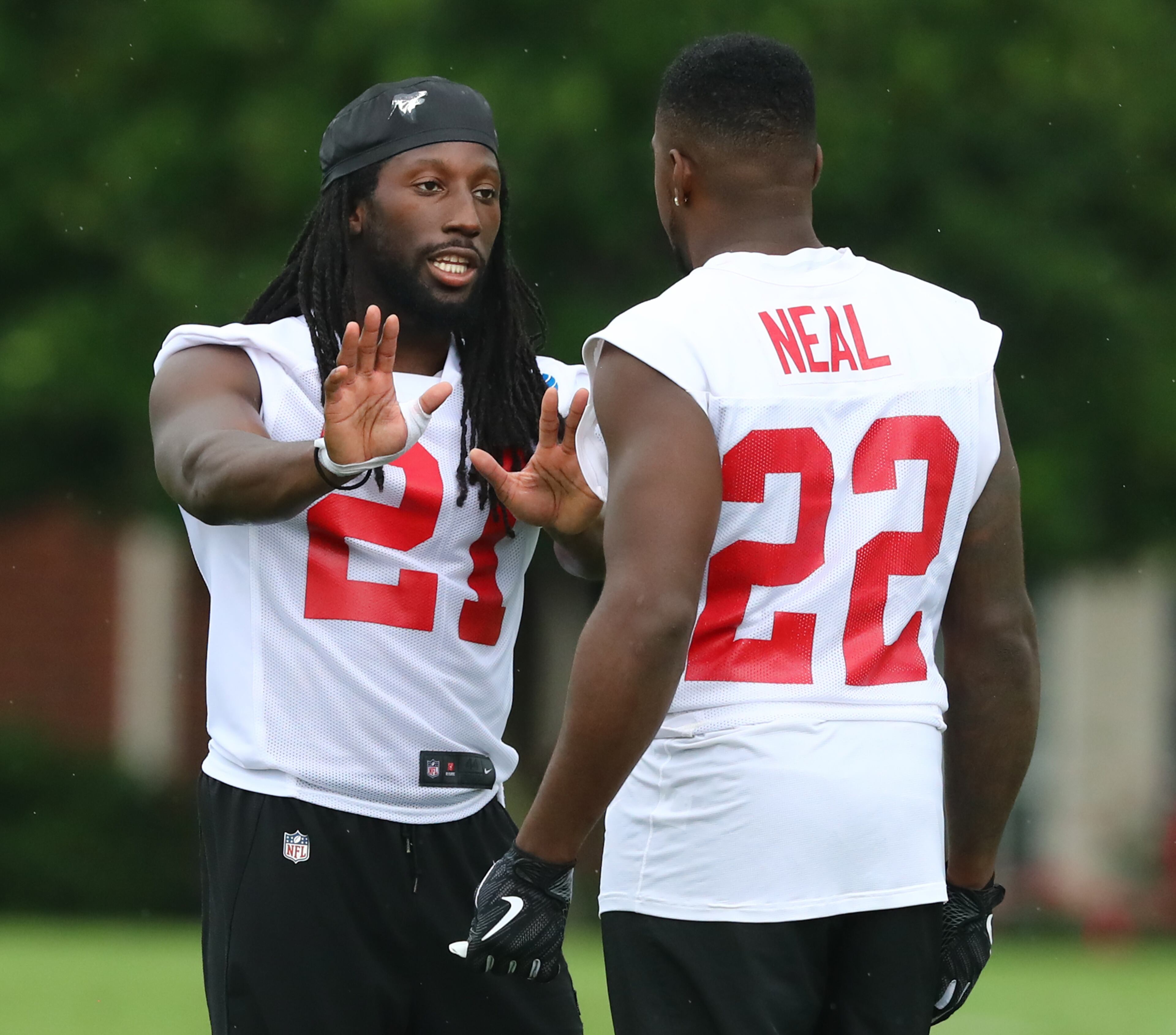 Falcons cornerback Desmond Trufant (right) gets in some extra work with safety Keanu Neal. Curtis Compton/ccompton@ajc.com