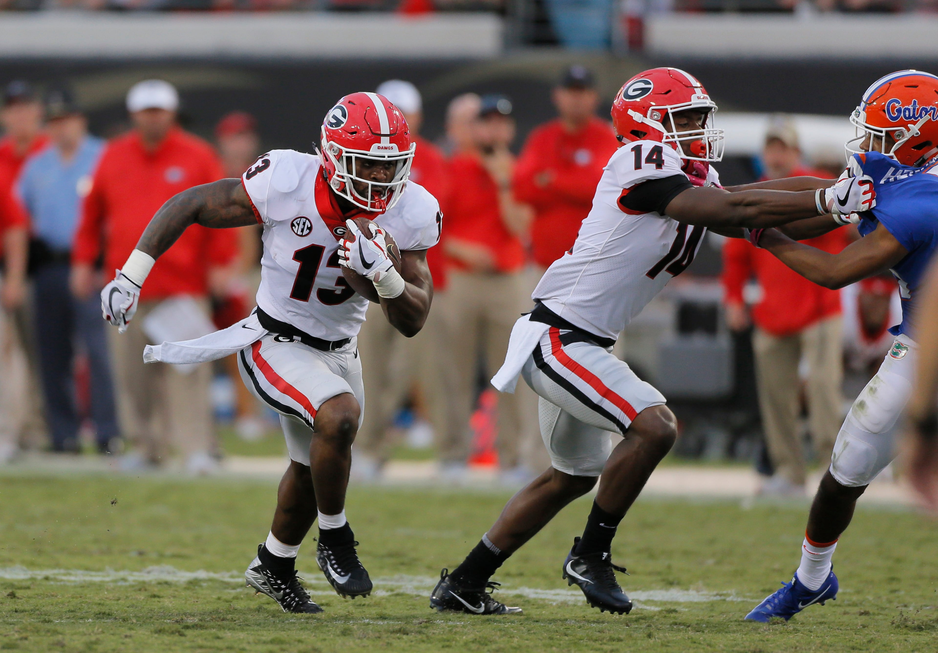 10/28/17 - Jacksonville, FL - Georgia Bulldogs running back Elijah Holyfield (13) takes off on a long second half run for a TD during the second half. NCAA football game between Georgia and Florida at EverBank Field in Jacksonville. Georgia defeated Florida 42-7. BOB ANDRES /BANDRES@AJC.COM