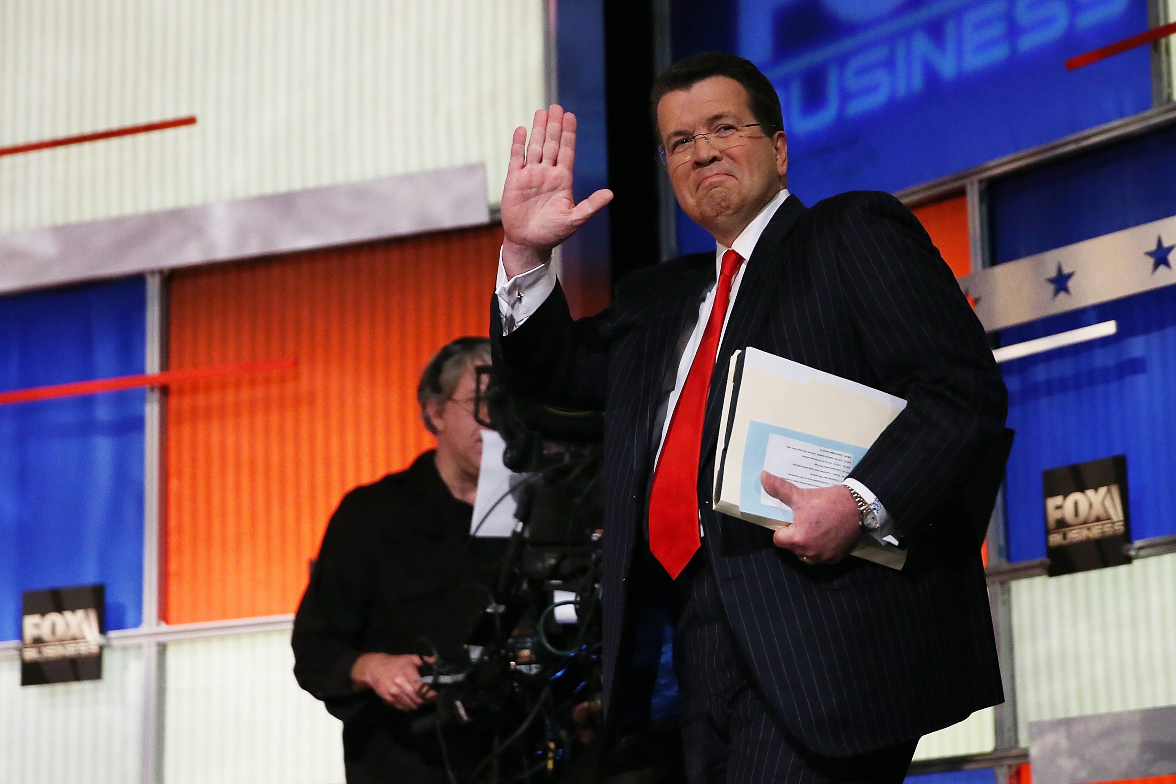Neil Cavuto, moderator of the Fox Business Network Republican presidential debate arrives on stage at the North Charleston Coliseum and Performing Arts Center on January 14, 2016 in North Charleston, South Carolina. (Photo by Andrew Burton/Getty Images)