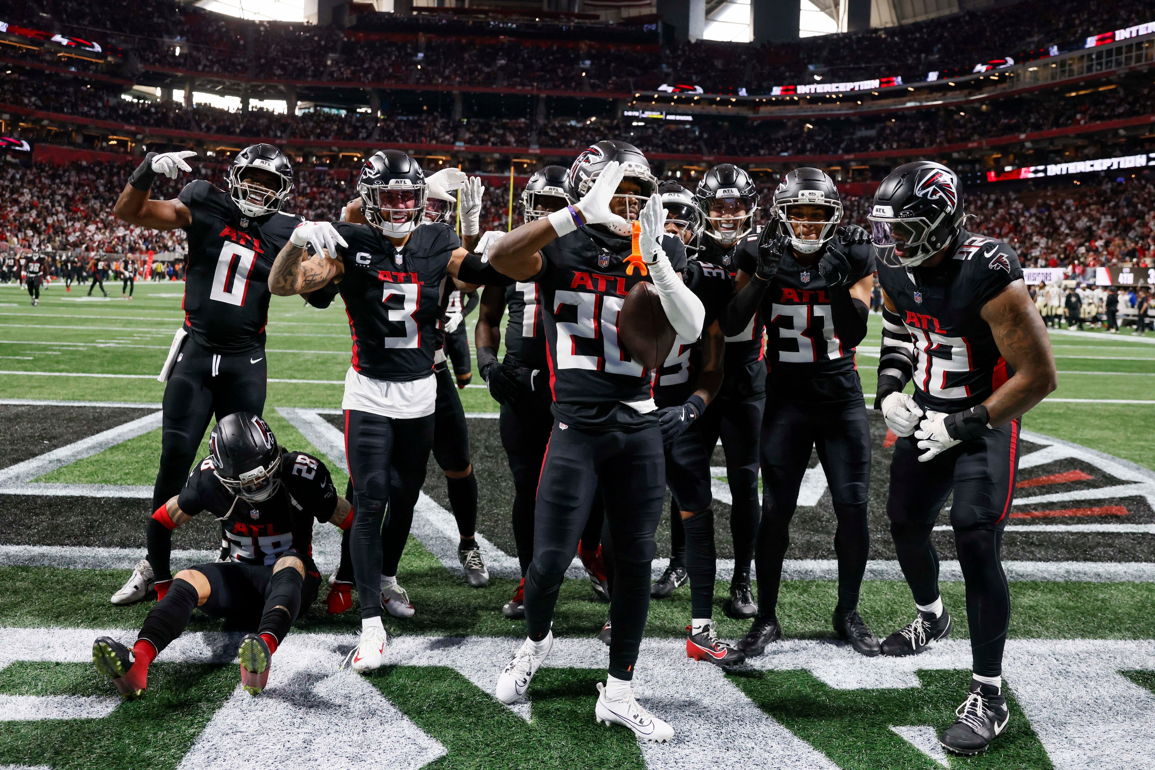 Atlanta Falcons cornerback Dee Alford (center) reacts after an interception in the second half of an NFL football game against the New Orleans Saints at Mercedes-Benz Stadium in Atlanta on Sunday, Jan. 4, 2026. (Miguel Martinez/AJC)