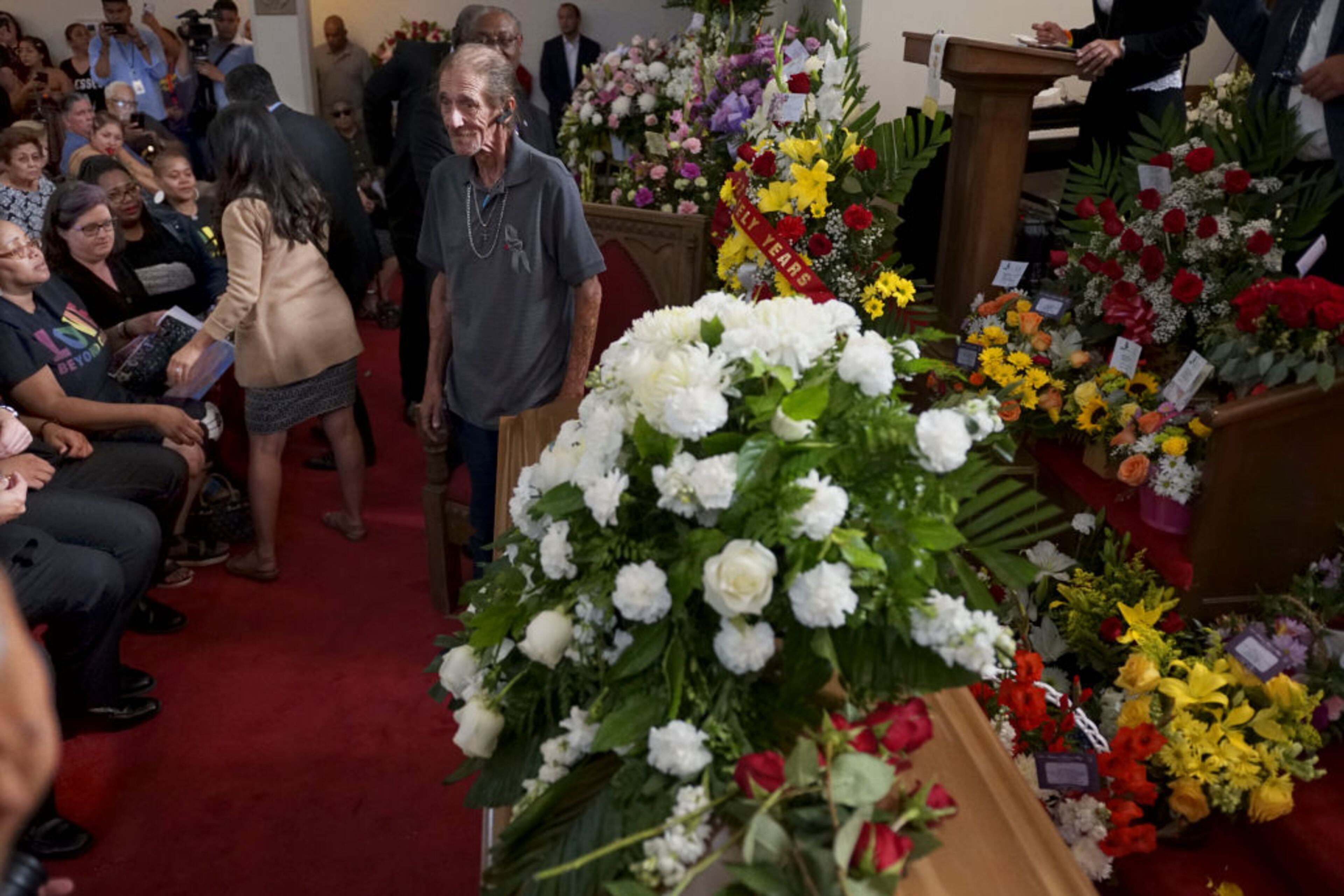 EL PASO, TX - AUGUST 16: Antonio Basco greets well wishers to a public memorial for his wife, Margie Reckard, on August 16, 2019 in El Paso, Texas. Reckard was one of 22 killed during the Walmart shooting in El Paso on August 3rd. Basco invited the public to attend the memorial in her honor and has laid fresh flowers everyday since the shooting at a make-shift memorial outside the outlet. (Photo by Sandy Huffaker/Getty Images)