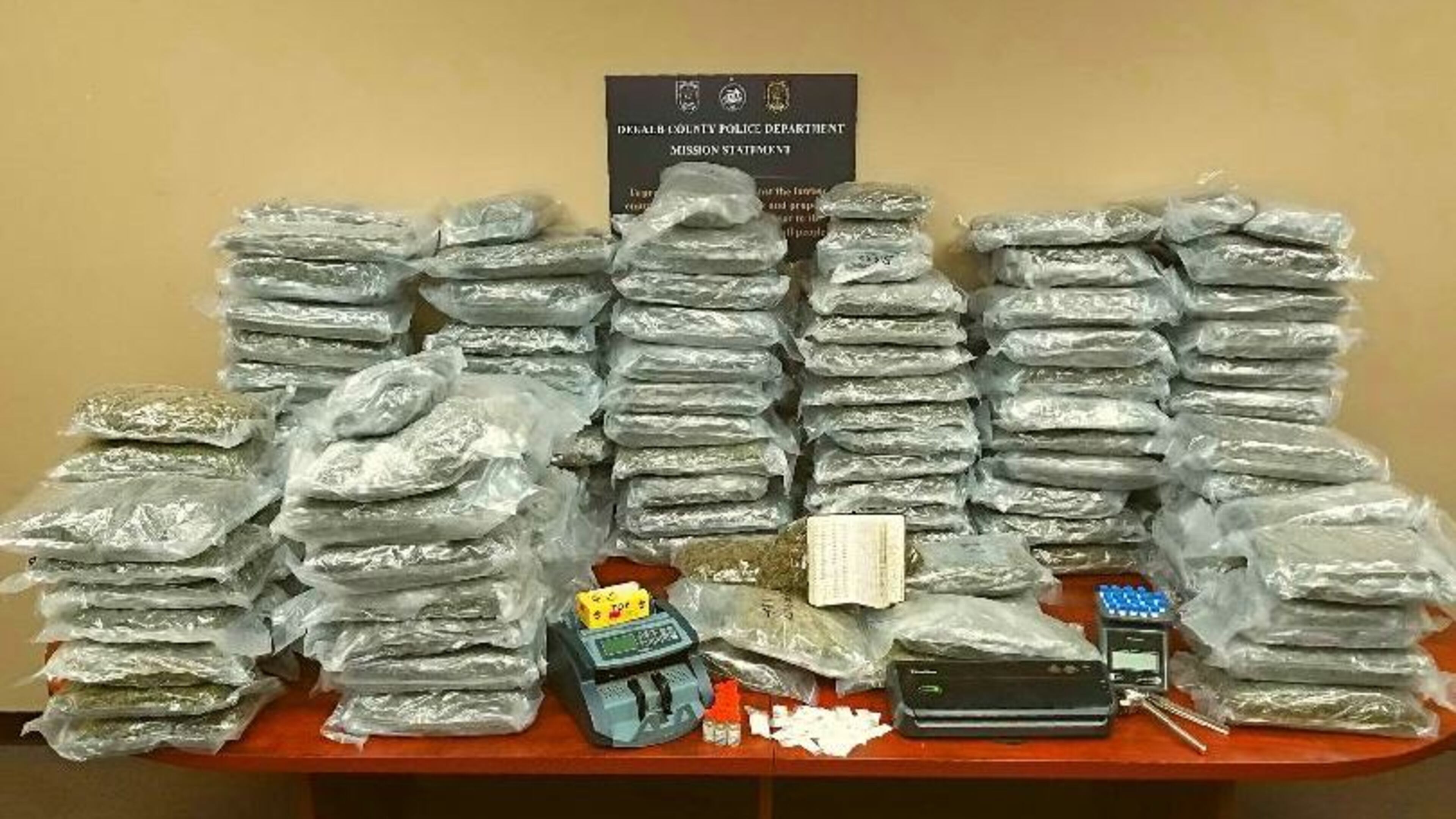 DeKalb police said Friday they seized 230 pounds of pot and arrested two people.