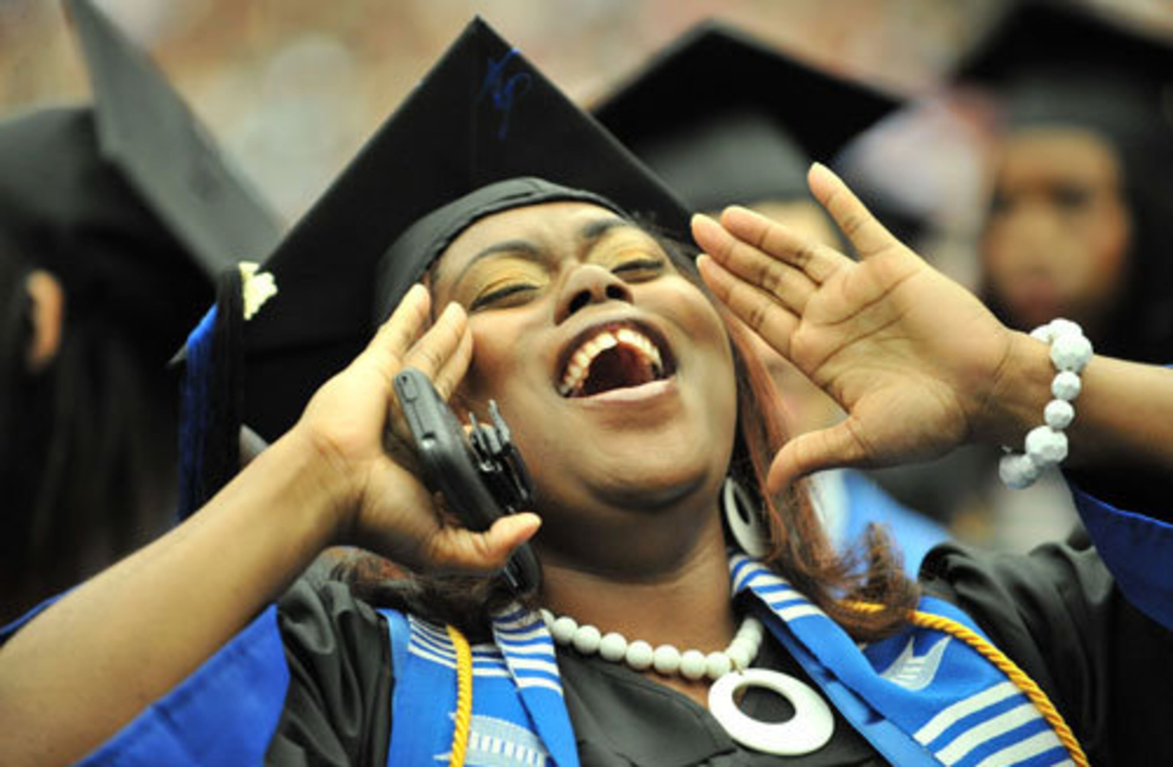 Asa Stallings, Theater Performance and Managerial Sciences major, cannot hide her excitement during the commencement ceremony at the Georgia Dome Saturday, May 7, 2011.