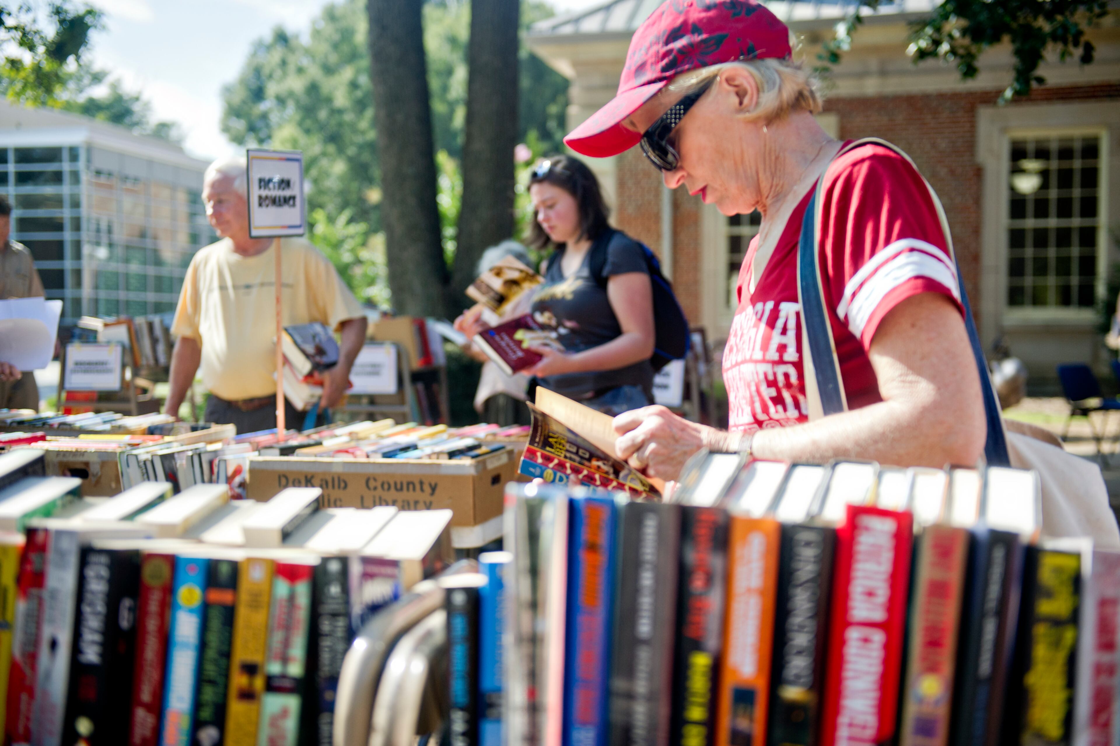 Jann Knowles looks at one of thousands of books for sale during the AJC Decatur Book Festival on Saturday, August 30, 2014. The ninth annual event saw tens of thousands of people come out to the downtown Decatur area to meet with world-class authors, illustrators, editors, publishers, booksellers, and artists for a weekend filled with literature, music, food, art, and fun.