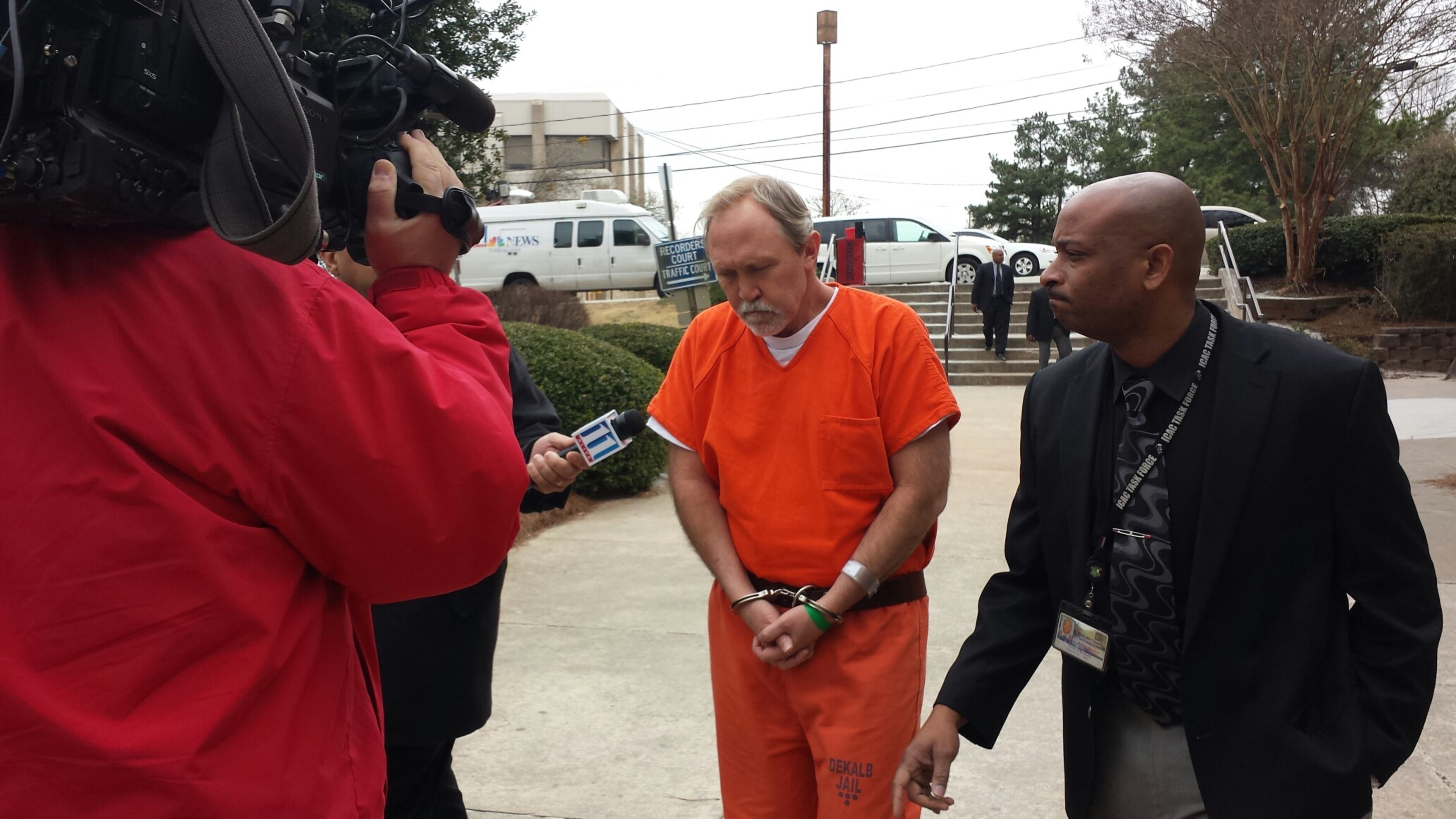John McGill was escorted into a DeKalb County courtroom Tuesday for his first appearance.