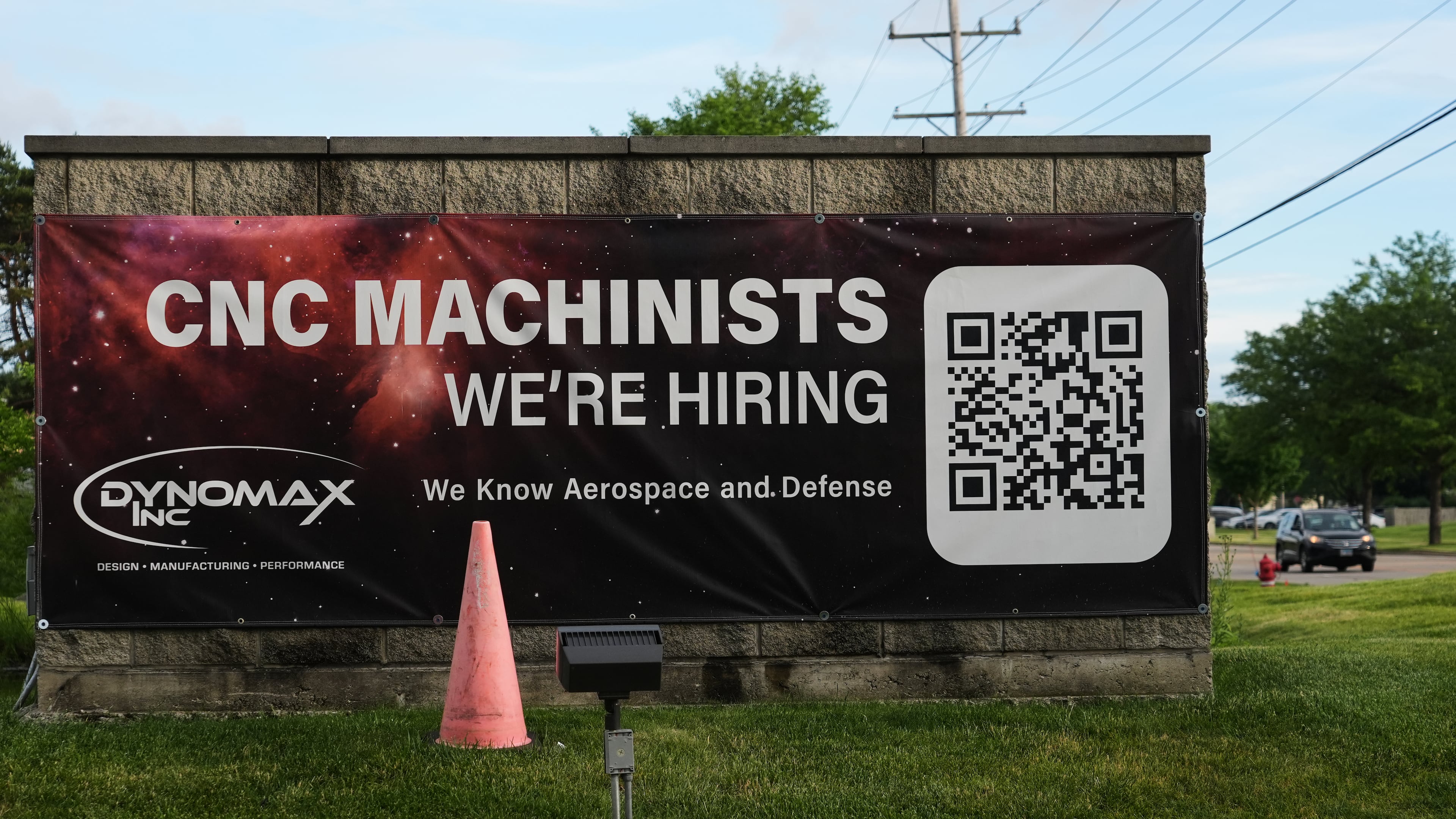 A hiring sign is seen outside of a company in Wheeling, Ill., Monday, June 8, 2026. (AP Photo/Nam Y. Huh)