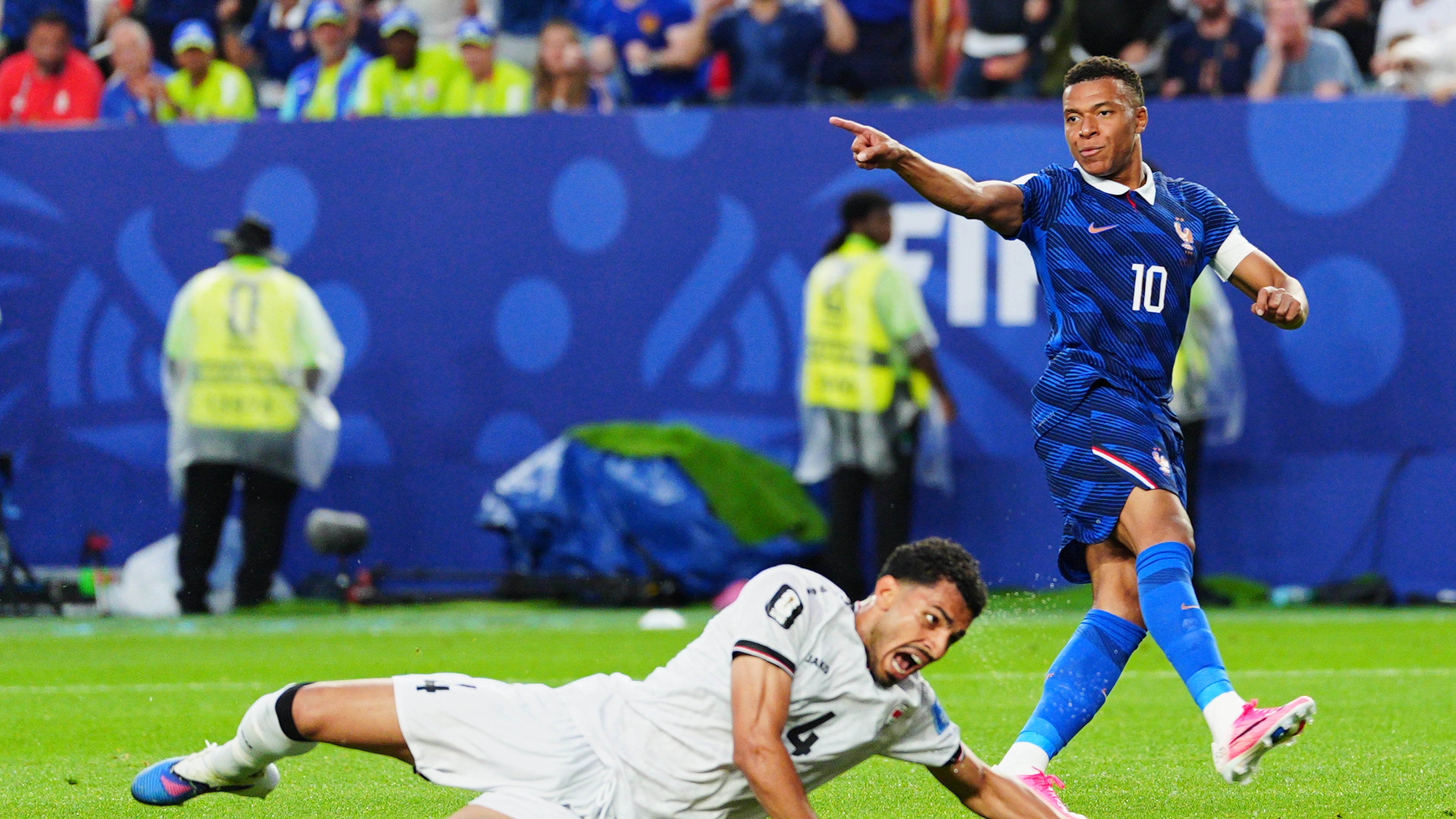 France's Kylian Mbappe (10) celebrates after scoring their second goal as Iraq's Zaid Tahseen (4) reacts during the World Cup Group I soccer match between France and Iraq in Philadelphia, Monday, June 22, 2026. (AP Photo/Derik Hamilton)