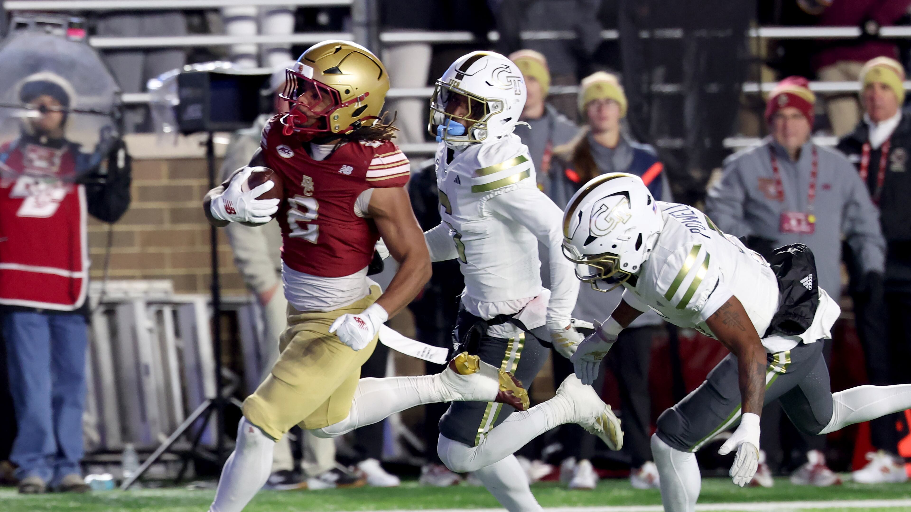 Boston College running back Turbo Richard, left, runs for a touchdown as Georgia Tech defensive backs Rodney Shelley, center, and Clayton Powell-Lee, right, pursue during the second half of an NCAA college football game Saturday, Nov. 15, 2025, in Boston. (Mark Stockwell/AP)