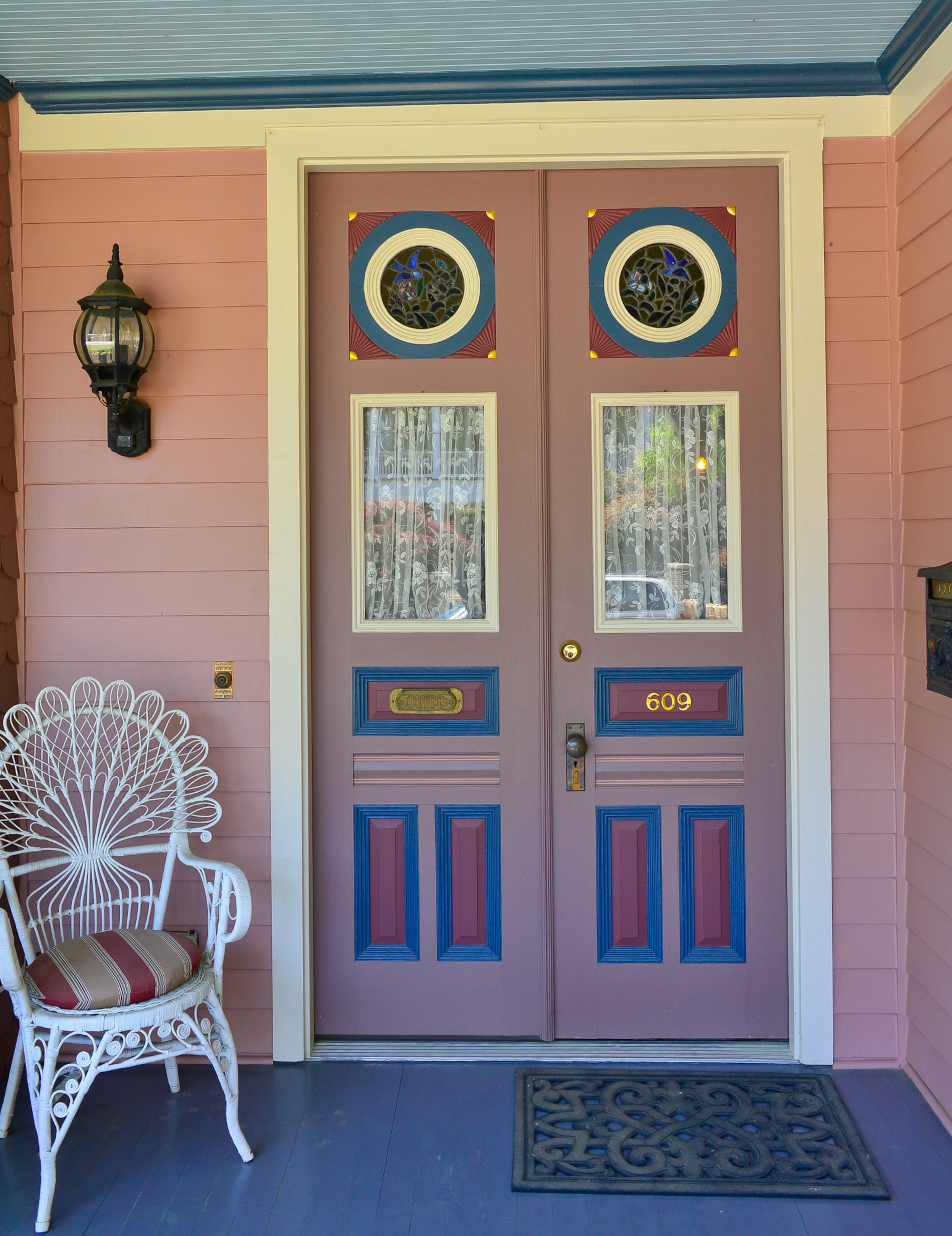 The front door, from Lakewood 400 Antiques Market in Cumming, is painted with a color scheme created specifically for the home. The home has been used as the setting for a few TV shows and movies.