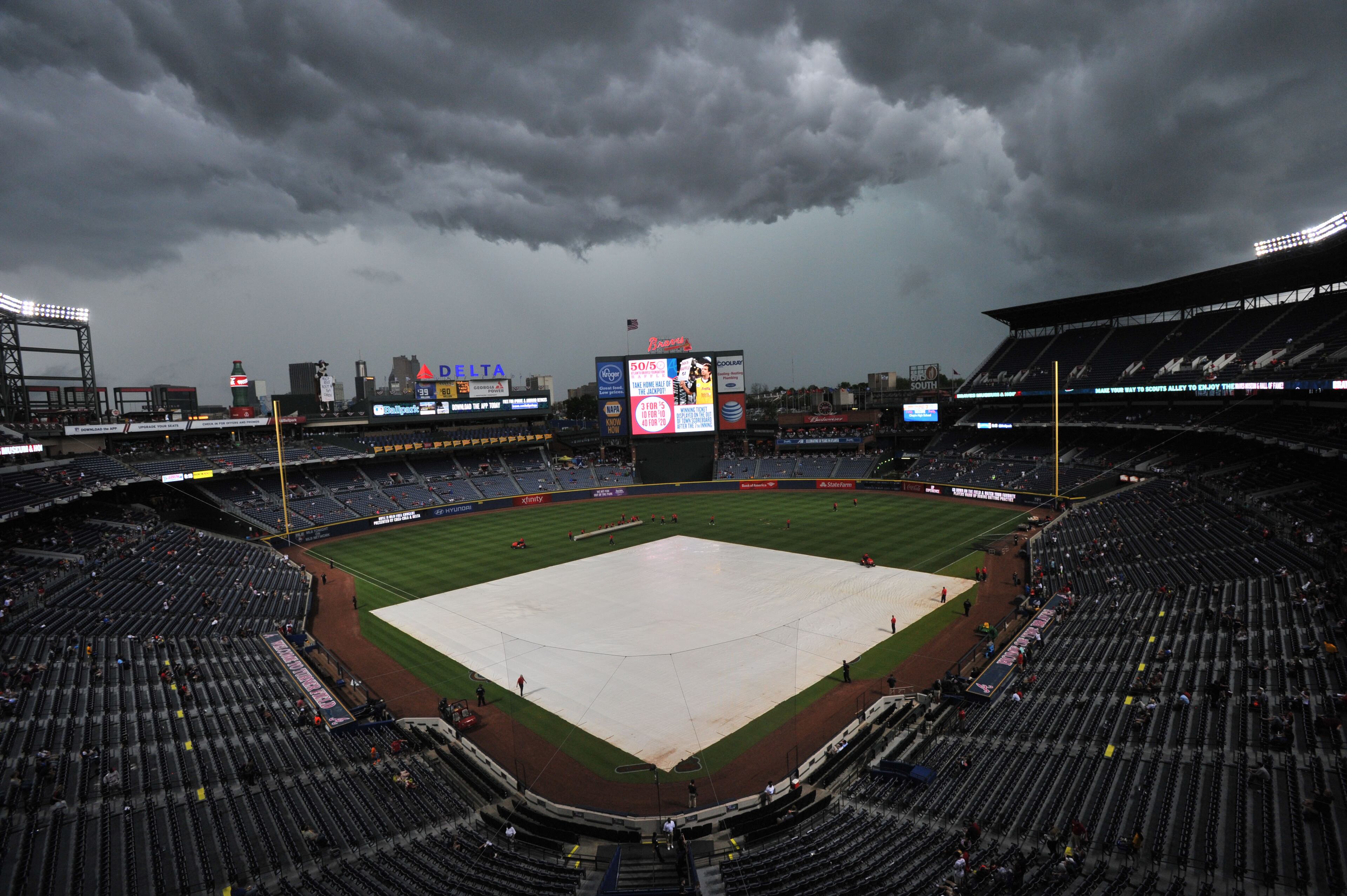 Rain clouds roll in before the Atlanta Braves season opener against the New York Mets at Turner Field in Atlanta on Friday, April 10, 2015. HYOSUB SHIN / HSHIN@AJC.COM