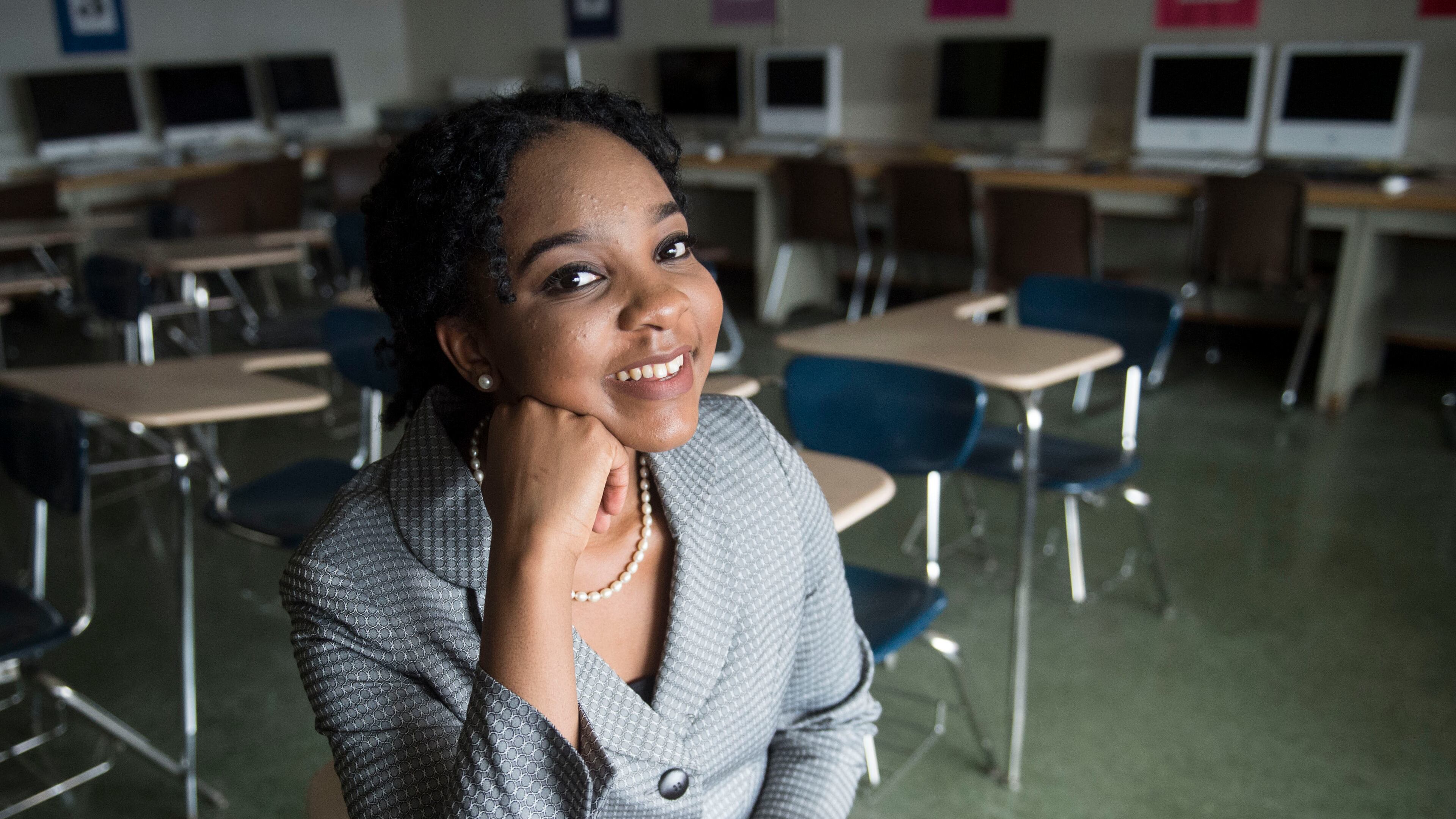 Elmont Memorial High School valedictorian Augusta Uwamanzu-Nna poses for a photo in an empty classroom in Elmont, N.Y. Uwamanzu-Nna has won acceptance to all 12 schools she applied for including all eight Ivy League universities. It’s the second time in as many years a student at the suburban New York high school has been accepted at all eight Ivy League universities.