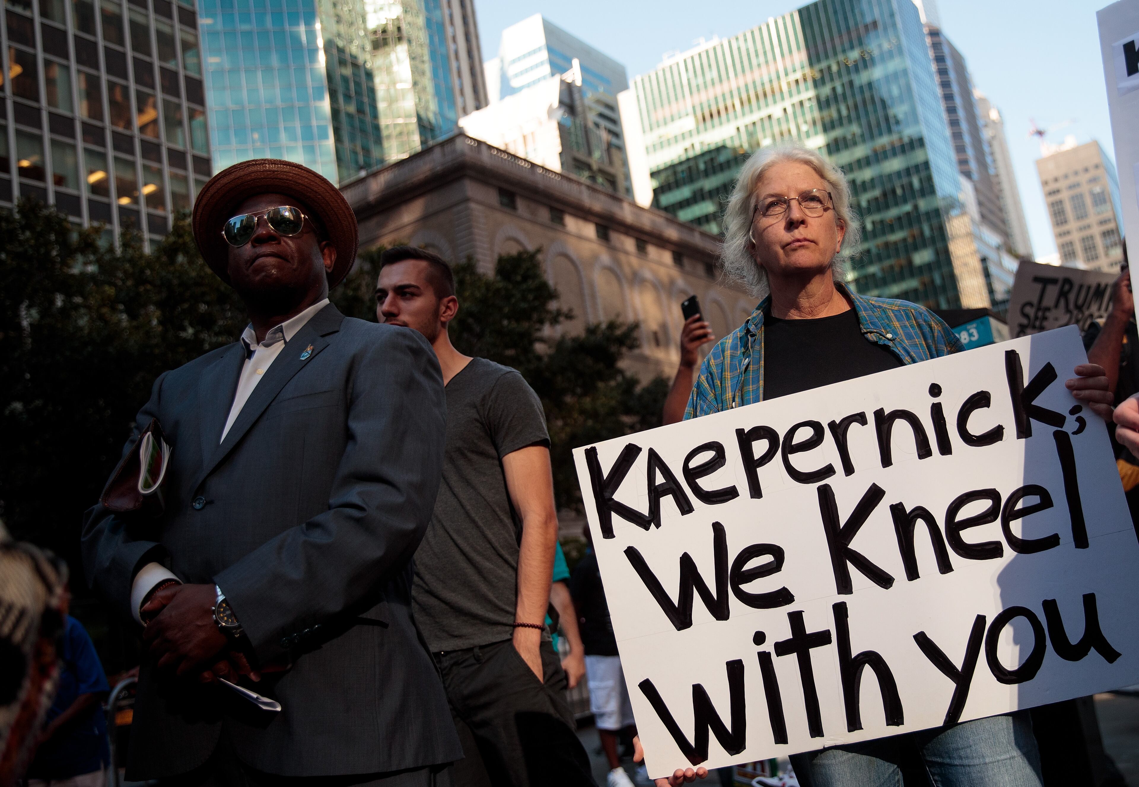 NEW YORK, NY - AUGUST 23: Activists rally in support of NFL quarterback Colin Kaepernick outside the offices of the National Football League on Park Avenue, August 23, 2017 in New York City. During the NFL season last year, Kaepernick caused controversy by kneeling during the National Anthem at games to protest racial oppression and police brutality. Kaepernick is currently a free agent and some critics and analysts claim NFL teams don't want to sign him due to his public display of his political beliefs. (Photo by Drew Angerer/Getty Images)